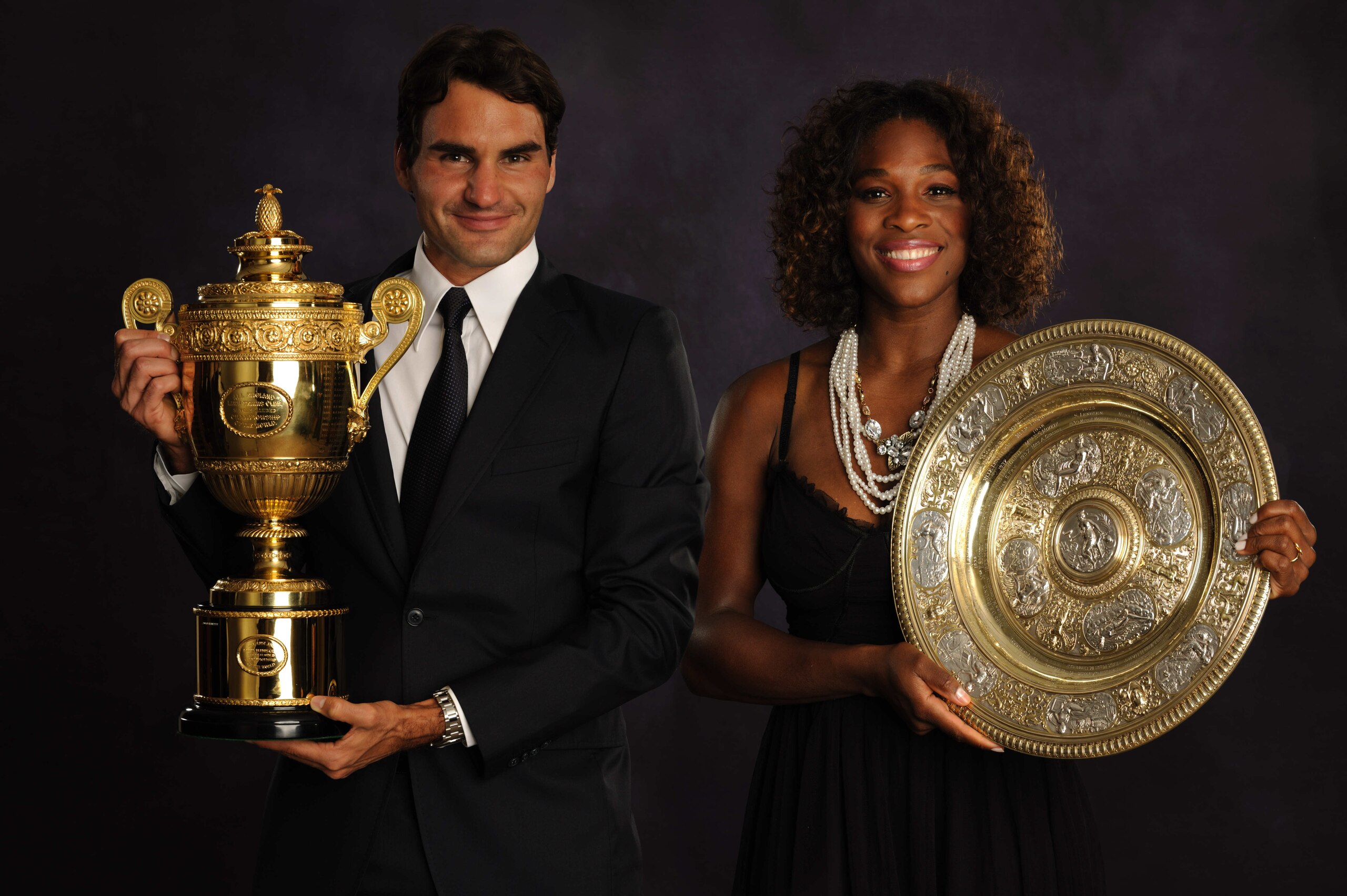 LONDON - JULY 5: (EDITORS NOTE: THIS IMAGE IS A COMPOSITE OF TWO SEPERATE PORTRAITS) In this handout image provided by the AELTC, Roger Federer of Switzerland, the Mens Singles Champion 2009 and Serena Williams of the United States, the Ladies Singles C LONDON - JULY 5: (EDITORS NOTE: THIS IMAGE IS A COMPOSITE OF TWO SEPERATE PORTRAITS) In this handout image provided by the AELTC, Roger Federer of Switzerland, the Mens Singles Champion 2009 and Serena Williams of the United States, the Ladies Singles C