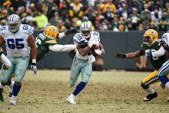Jan 11, 2015; Green Bay, WI, USA; Dallas Cowboys running back DeMarco Murray (29) looses the ball after being tackled by Green Bay Packers inside linebacker Brad Jones (59) the Green Bay Packers in the 2014 NFC Divisional playoff football game at Lambeau