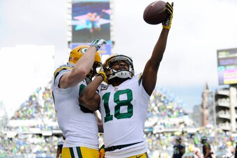 Jan 18, 2015; Seattle, WA, USA; Green Bay Packers wide receiver Randall Cobb (18) celebrates his first quarter touchdown catch with Jody Nelson against the Seattle Seahawks in the NFC Championship Game at CenturyLink Field. Mandatory Credit: Steven Bisig-
