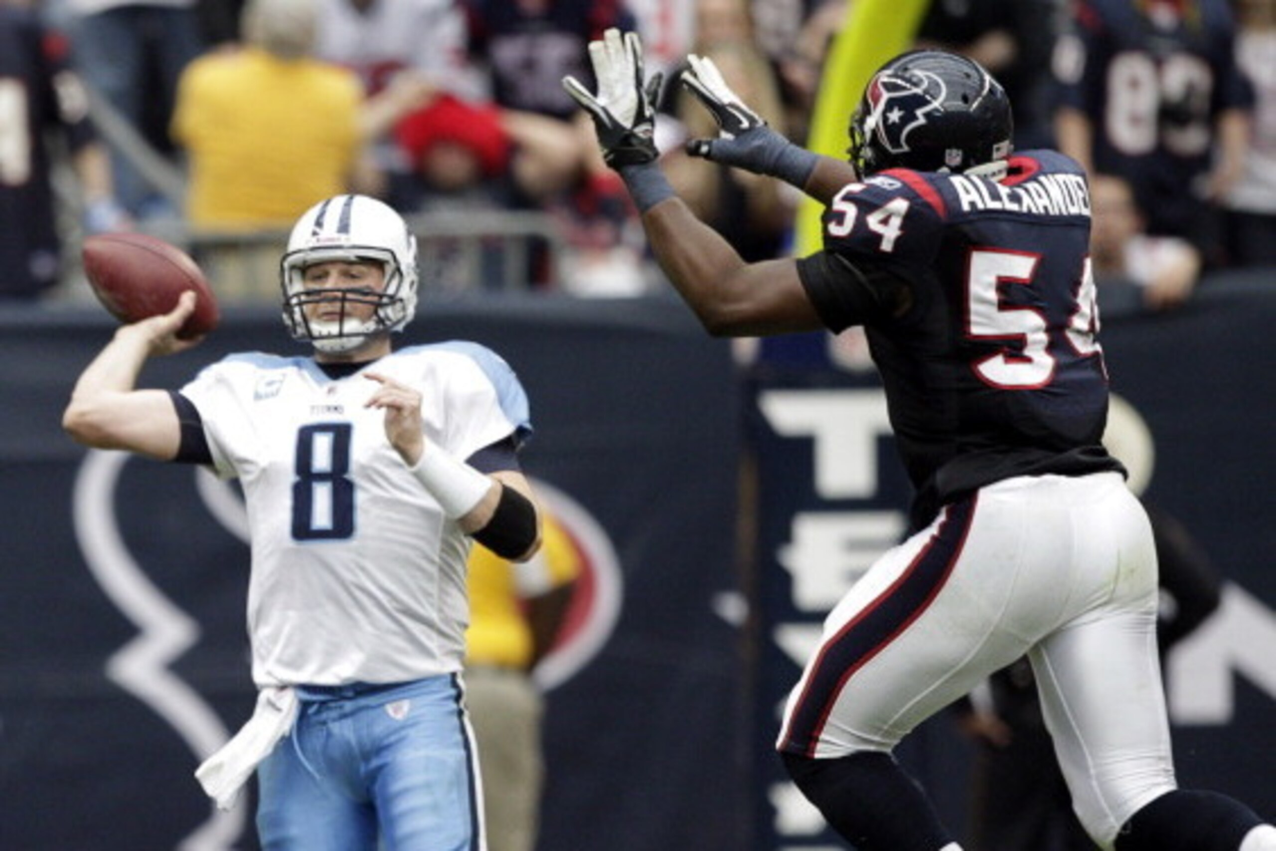HOUSTON, TX - JANUARY 01: Quarterback Matt Hasselbeck #8 of the Tennessee Titans throws downfield as he is pressured by Mister Alexander #54 of the Houston Texans at Reliant Stadium on January 1, 2012 in Houston, Texas. (Photo by Bob Levey/Getty Images) HOUSTON, TX - JANUARY 01: Quarterback Matt Hasselbeck #8 of the Tennessee Titans throws downfield as he is pressured by Mister Alexander #54 of the Houston Texans at Reliant Stadium on January 1, 2012 in Houston, Texas. (Photo by Bob Levey/Getty Images)