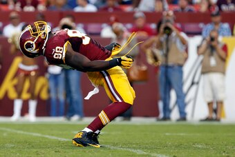 Aug 7, 2014; Landover, MD, USA; Washington Redskins outside linebacker Brian Orakpo (98) celebrates after sacking New England Patriots quarterback Ryan Mallett (not pictured) in the first quarter at FedEx Field. Mandatory Credit: Geoff Burke-USA TODAY Spo