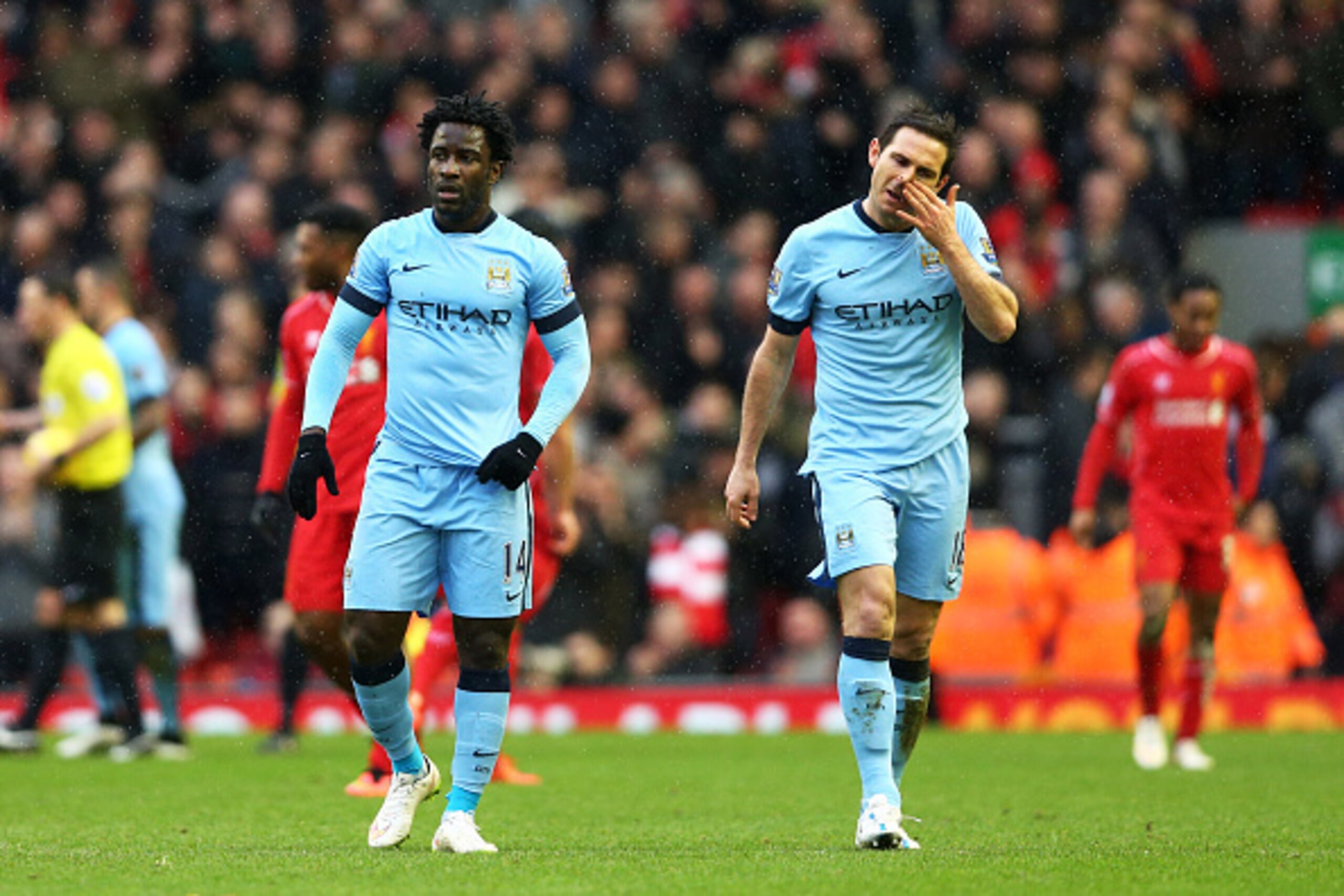 LIVERPOOL, ENGLAND - MARCH 01:  The dejected Wilfred Bony and Frank Lampard of Manchester City walk off the pitch following their team's 2-1 defeat during the Barclays Premier League match between Liverpool and Manchester City at Anfield on March 1, 2015 