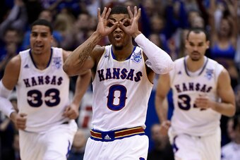 LAWRENCE, KS - FEBRUARY 28:  Frank Mason III #0 of the Kansas Jayhawks celebrates a three-point shot against against the Texas Longhorns in the second half at Allen Fieldhouse on February 28, 2015 in Lawrence, Kansas. Kansas won 69-64. (Photo by Ed Zurga/