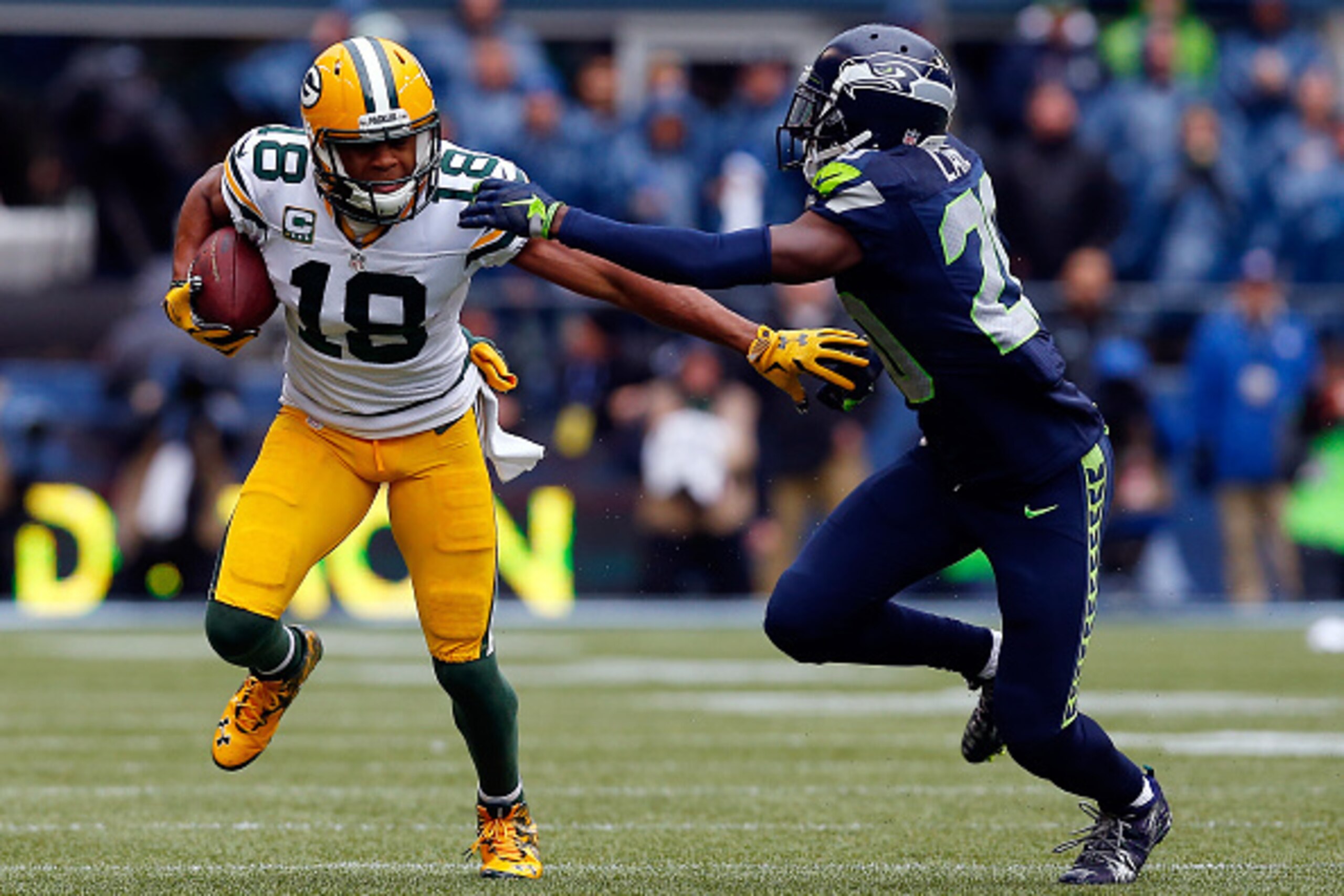 SEATTLE, WA - JANUARY 18: Randall Cobb #18 of the Green Bay Packers carries the ball as Jeremy Lane #20 of the Seattle Seahawks defends during the 2015 NFC Championship game at CenturyLink Field on January 18, 2015 in Seattle, Washington. (Photo by Tom SEATTLE, WA - JANUARY 18: Randall Cobb #18 of the Green Bay Packers carries the ball as Jeremy Lane #20 of the Seattle Seahawks defends during the 2015 NFC Championship game at CenturyLink Field on January 18, 2015 in Seattle, Washington. (Photo by Tom