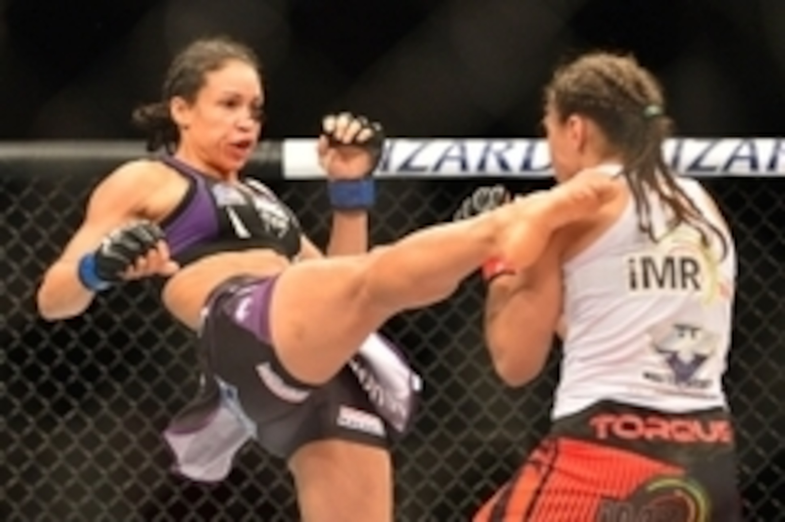 Feb 22, 2015; Porto Alegre, Brazil;  Marion Reneau (blue gloves) fights against Jessica Andrade (red gloves) during UFC Fight Night at Ginasio do Gigantinho. Mandatory Credit: Jason da Silva-USA TODAY Sports