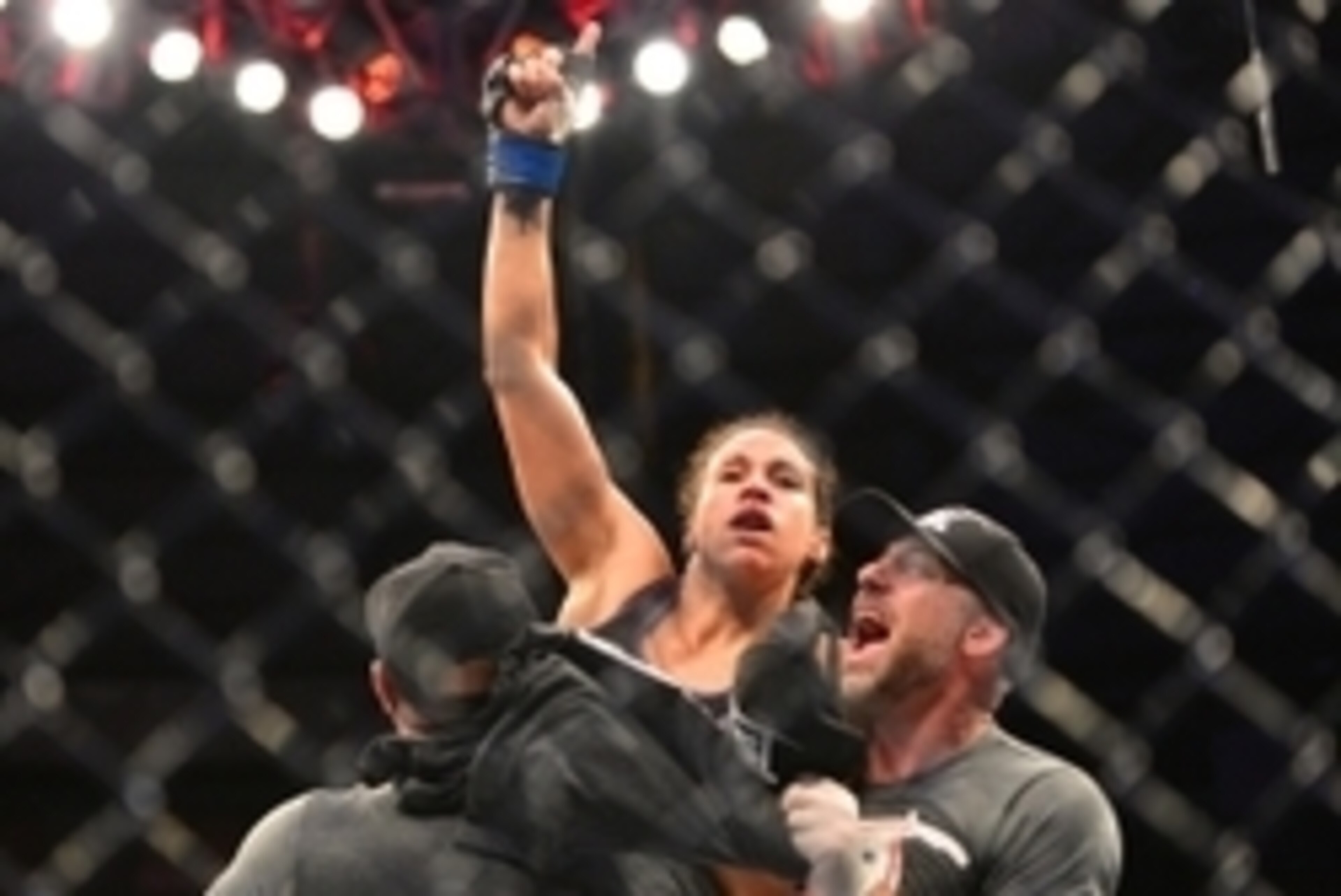 Feb 22, 2015; Porto Alegre, Brazil;  Marion Reneau (blue gloves) reacts after defeating Jessica Andrade (red gloves) during UFC Fight Night at Ginasio do Gigantinho. Mandatory Credit: Jason da Silva-USA TODAY Sports