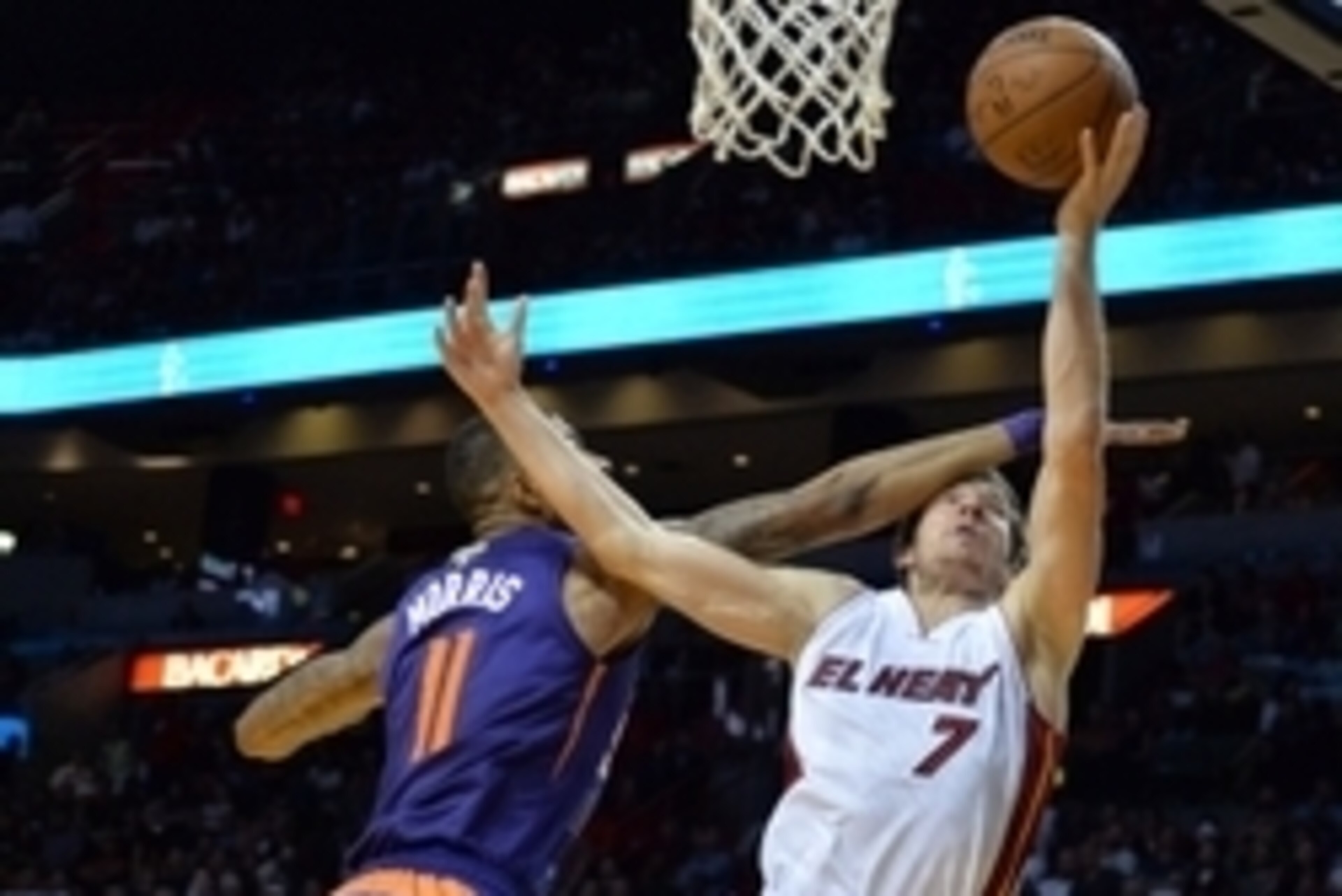 Mar 2, 2015; Miami, FL, USA; Phoenix Suns forward Markieff Morris (11) fouls Miami Heat guard Goran Dragic (7) during the second half at American Airlines Arena. Mandatory Credit: Steve Mitchell-USA TODAY Sports