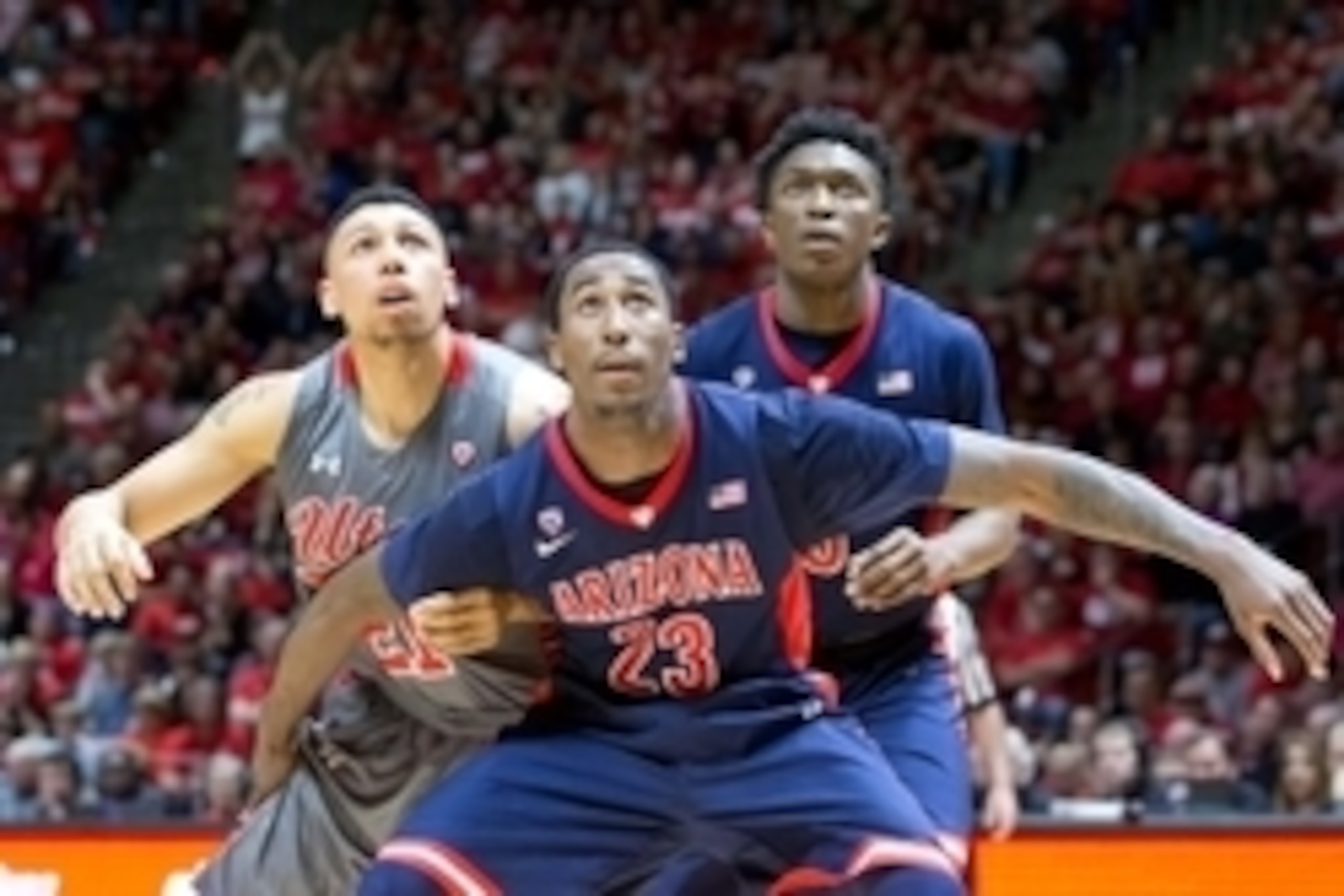Feb 28, 2015; Salt Lake City, UT, USA; Arizona Wildcats forward Rondae Hollis-Jefferson (23) and forward Stanley Johnson (5) box out Utah Utes forward Jordan Loveridge (21) during the second half at Jon M. Huntsman Center. Arizona won 63-57. Mandatory Cre