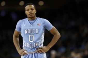 Feb 7, 2015; Chestnut Hill, MA, USA; North Carolina Tar Heels guard Nate Britt (0) reacts during the second half against the Boston College Eagles at Silvio O. Conte Forum.   The North Carolina Tar Heels won 79-68. Mandatory Credit: Greg M. Cooper-USA TOD