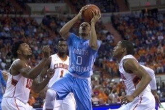 Jan 3, 2015; Clemson, SC, USA; North Carolina Tar Heels guard Nate Britt (0) drives to the basket during the second half against the Clemson Tigers at Littlejohn Coliseum. Tar Heels won 74-50. Mandatory Credit: Joshua S. Kelly-USA TODAY Sports