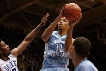 Feb 18, 2015; Durham, NC, USA; North Carolina Tar Heels forward Brice Johnson (11) drives against Duke Blue Devils forward Justise Winslow (12) in their game at Cameron Indoor Stadium. Mandatory Credit: Mark Dolejs-USA TODAY Sports