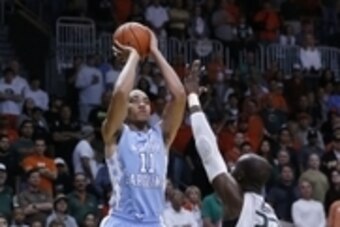Feb 28, 2015; Coral Gables, FL, USA; North Carolina Tar Heels forward Brice Johnson (11) shoots the ball over Miami Hurricanes center Tonye Jekiri (23) in the first half at BankUnited Center. Mandatory Credit: Robert Mayer-USA TODAY Sports
