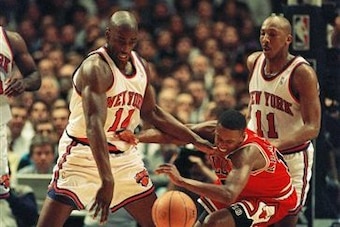 Anthony Mason and Derek Harper face the Bulls' B.J. Armstrong in 1994.