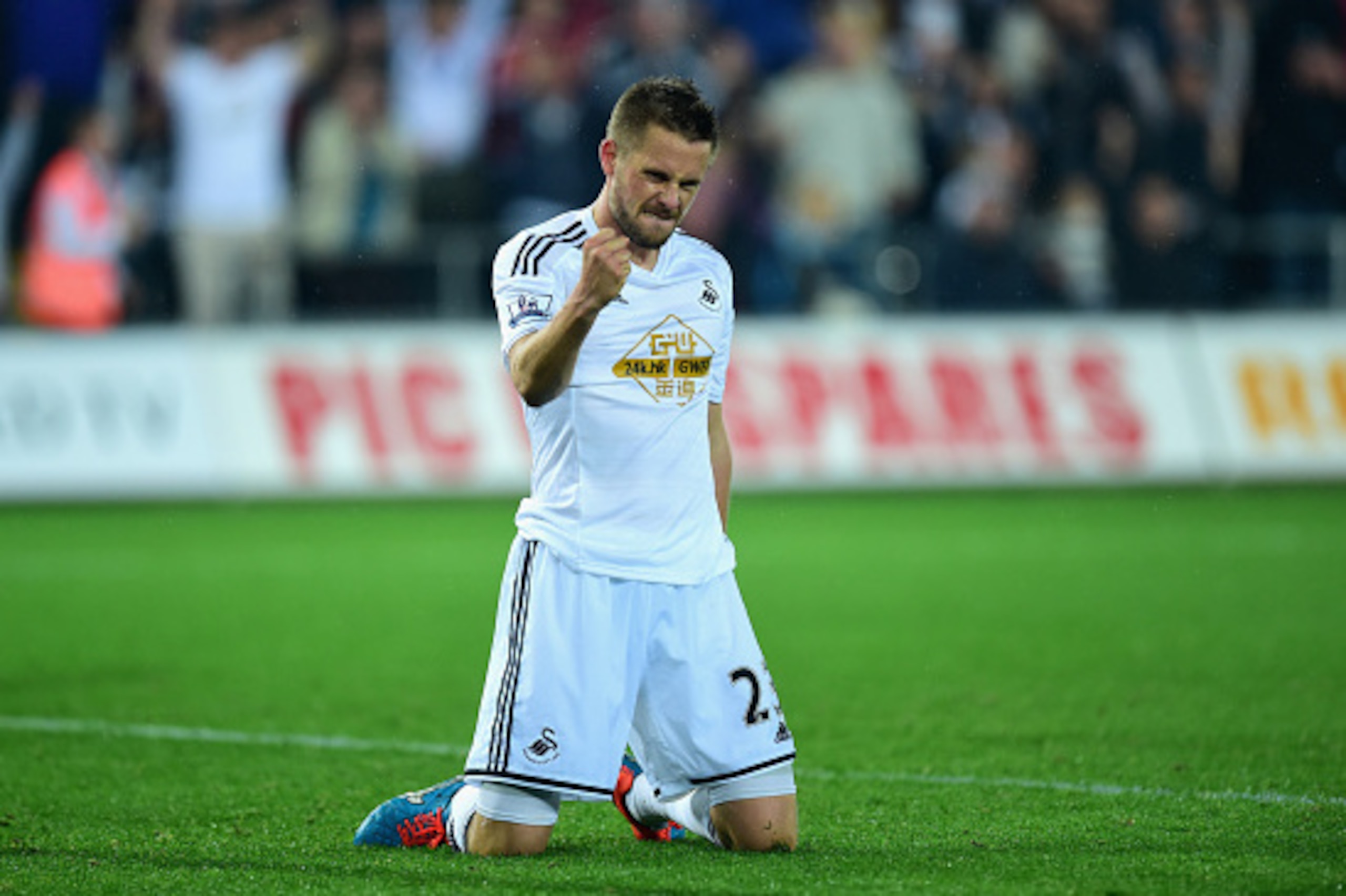 SWANSEA, WALES - SEPTEMBER 23:  Swansea player Gylfi Sigurdsson celebrates after scoring the second Swansea goal during the Capital One Cup Third Round match between Swansea City and Everton at Liberty Stadium on September 23, 2014 in Swansea, Wales.  (Ph