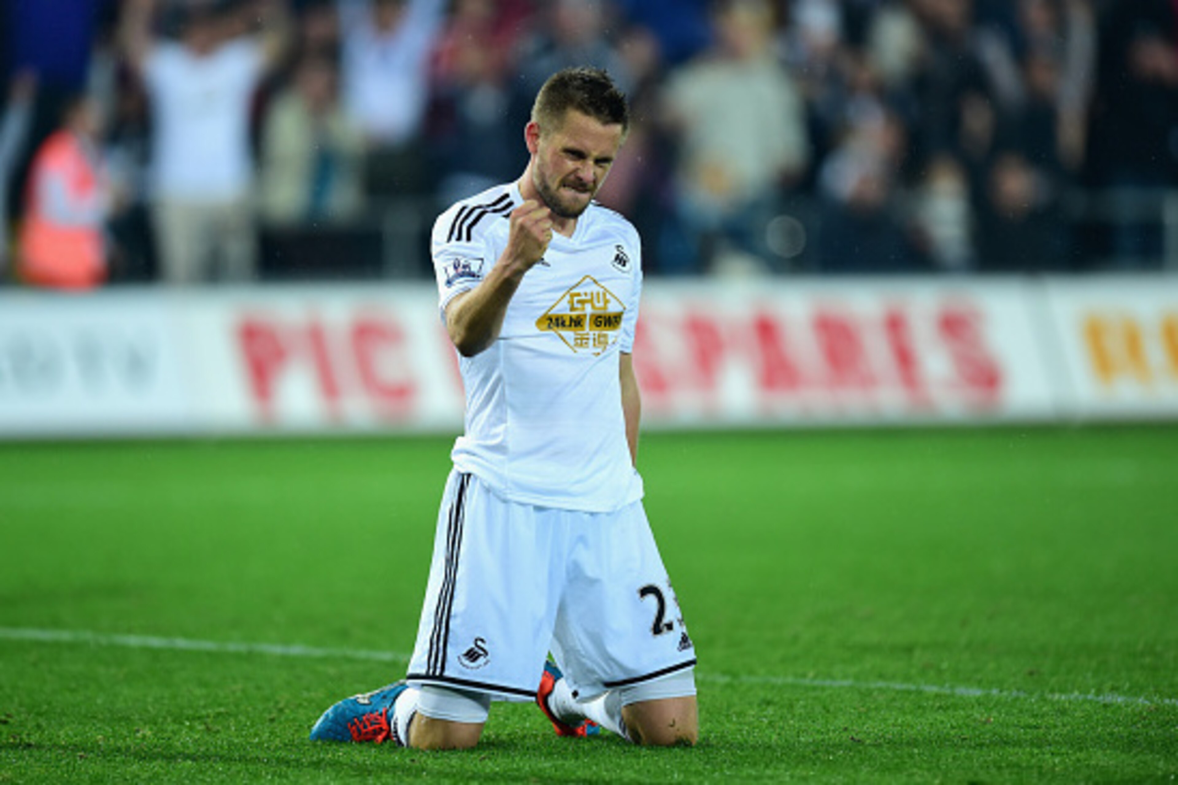 SWANSEA, WALES - SEPTEMBER 23:  Swansea player Gylfi Sigurdsson celebrates after scoring the second Swansea goal during the Capital One Cup Third Round match between Swansea City and Everton at Liberty Stadium on September 23, 2014 in Swansea, Wales.  (Ph