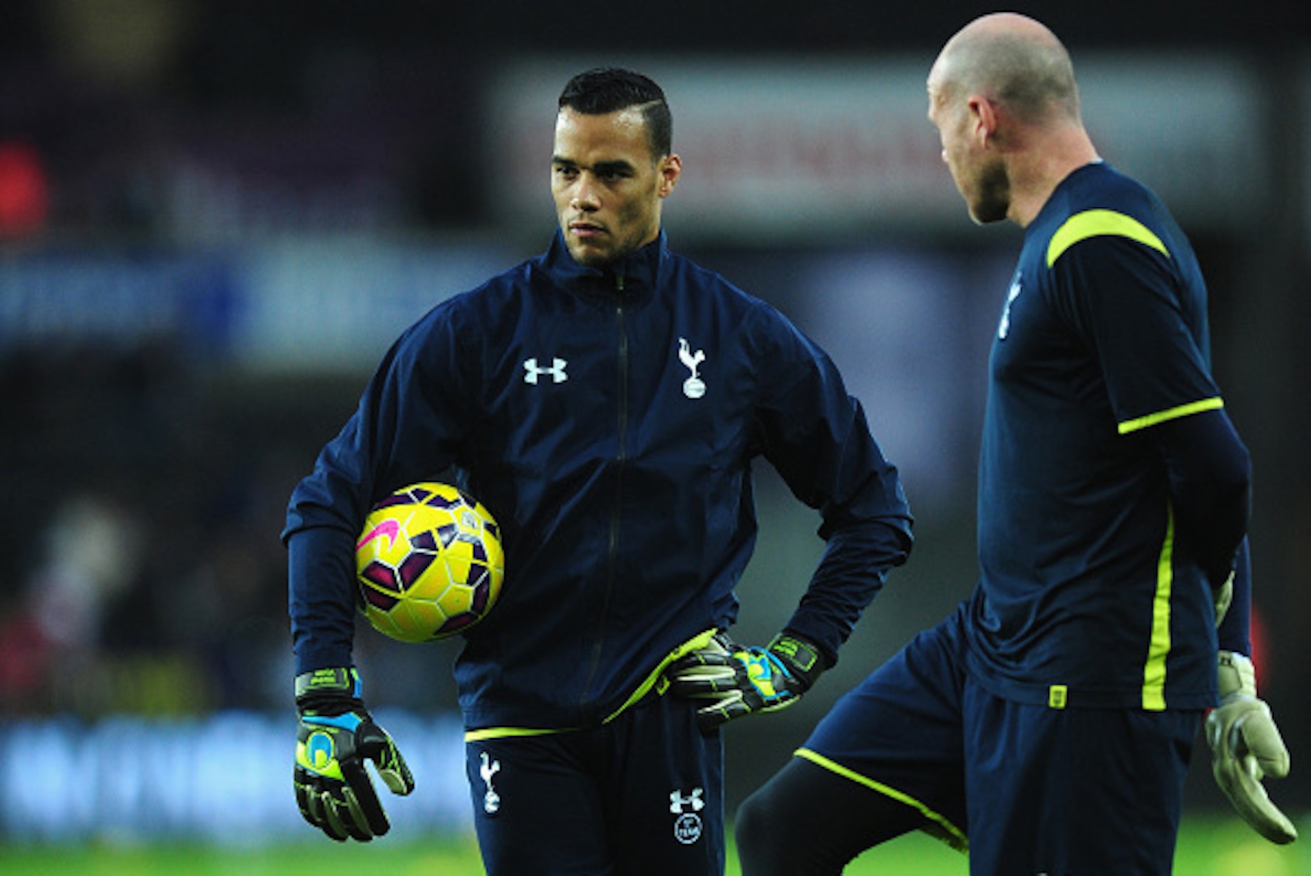 SWANSEA, WALES - DECEMBER 14:  Spurs goalkeepers Brad Friedel (r) and  former Swansea player Michel Vorm look on before the Barclays Premier League match between Swansea City and Tottenham Hotspur at Liberty Stadium on December 14, 2014 in Swansea, Wales.