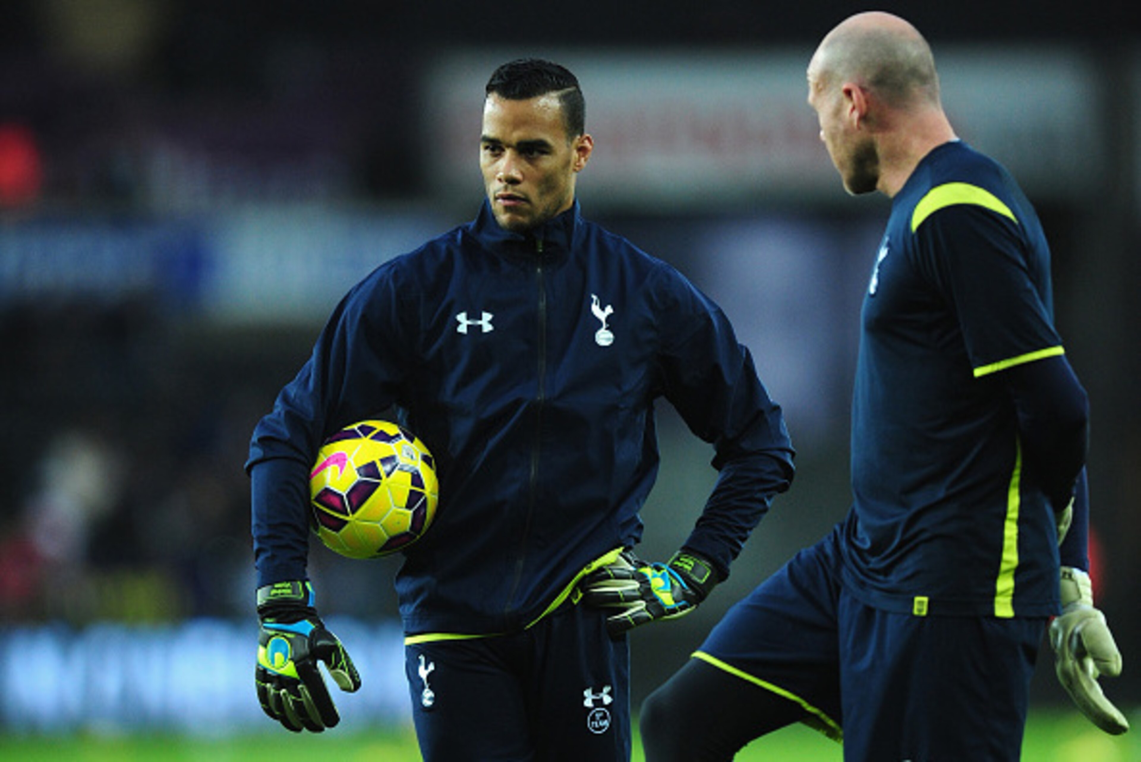 SWANSEA, WALES - DECEMBER 14:  Spurs goalkeepers Brad Friedel (r) and  former Swansea player Michel Vorm look on before the Barclays Premier League match between Swansea City and Tottenham Hotspur at Liberty Stadium on December 14, 2014 in Swansea, Wales.