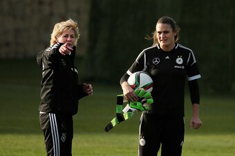 MARBELLA, SPAIN - FEBRUARY 09:  Head coach Silvia Neid talks with goalkeeper Nadine Angerer during a Germany Women's Training Session at Marbella Football Center on February 9, 2015 in Marbella, Spain.  (Photo by Sergio Camacho/Getty Images)