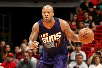 MIAMI, FL - MARCH 2: P.J. Tucker #17 of the Phoenix Suns drives against the Miami Heat on March 2, 2015 at American Airlines Arena in Miami, Florida.  NOTE TO USER: User expressly acknowledges and agrees that, by downloading and or using this Photograph, 