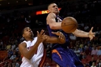 Mar 2, 2015; Miami, FL, USA; Miami Heat center Hassan Whiteside (21) and Phoenix Suns center Alex Len (21) both reach for a rebound during the first half at American Airlines Arena. Mandatory Credit: Steve Mitchell-USA TODAY Sports