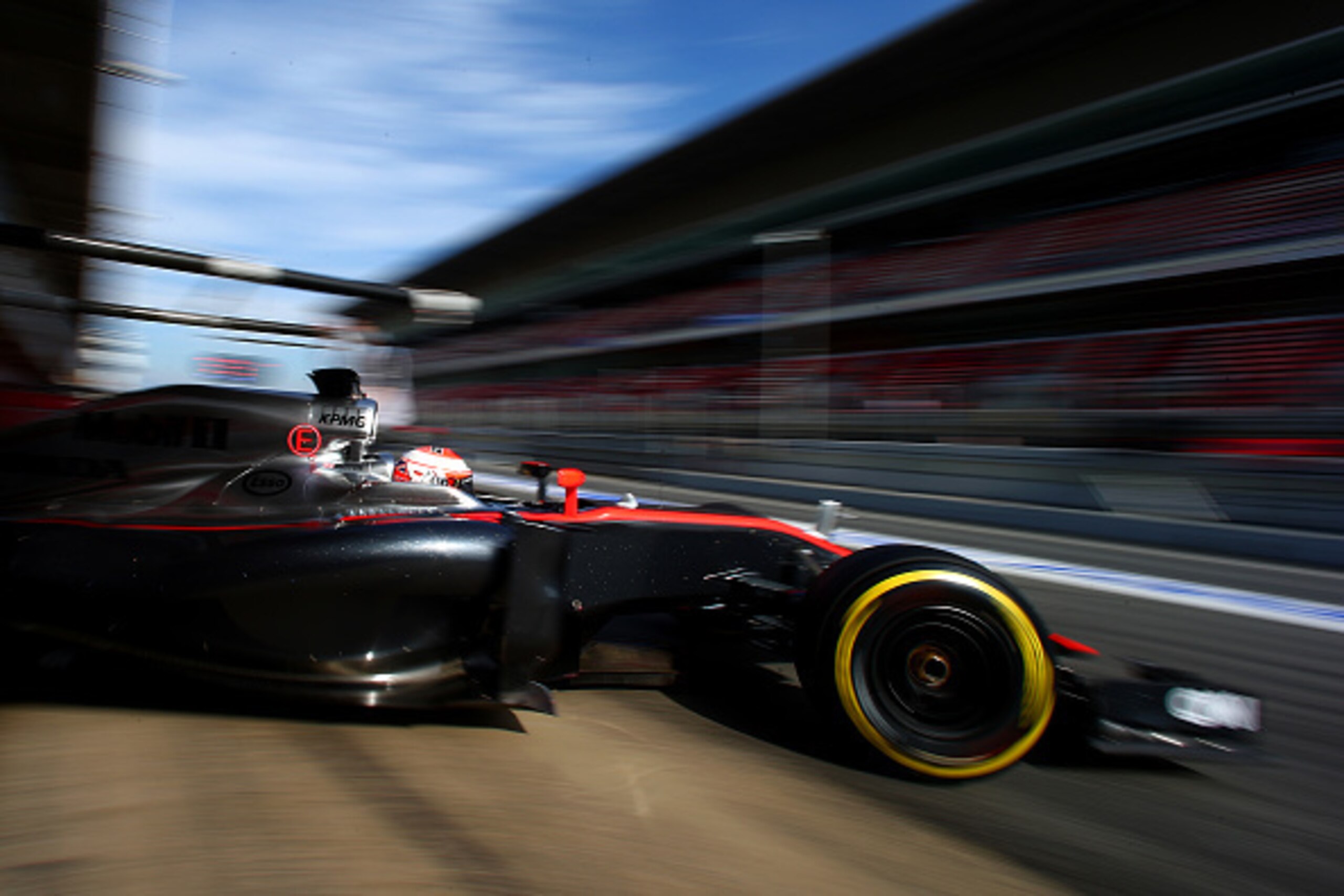 MONTMELO, SPAIN - MARCH 01:  Jenson Button of Great Britain and McLaren Honda exits the garage during day four of the final Formula One Winter Testing at Circuit de Catalunya on March 1, 2015 in Montmelo, Spain.  (Photo by Mark Thompson/Getty Images)