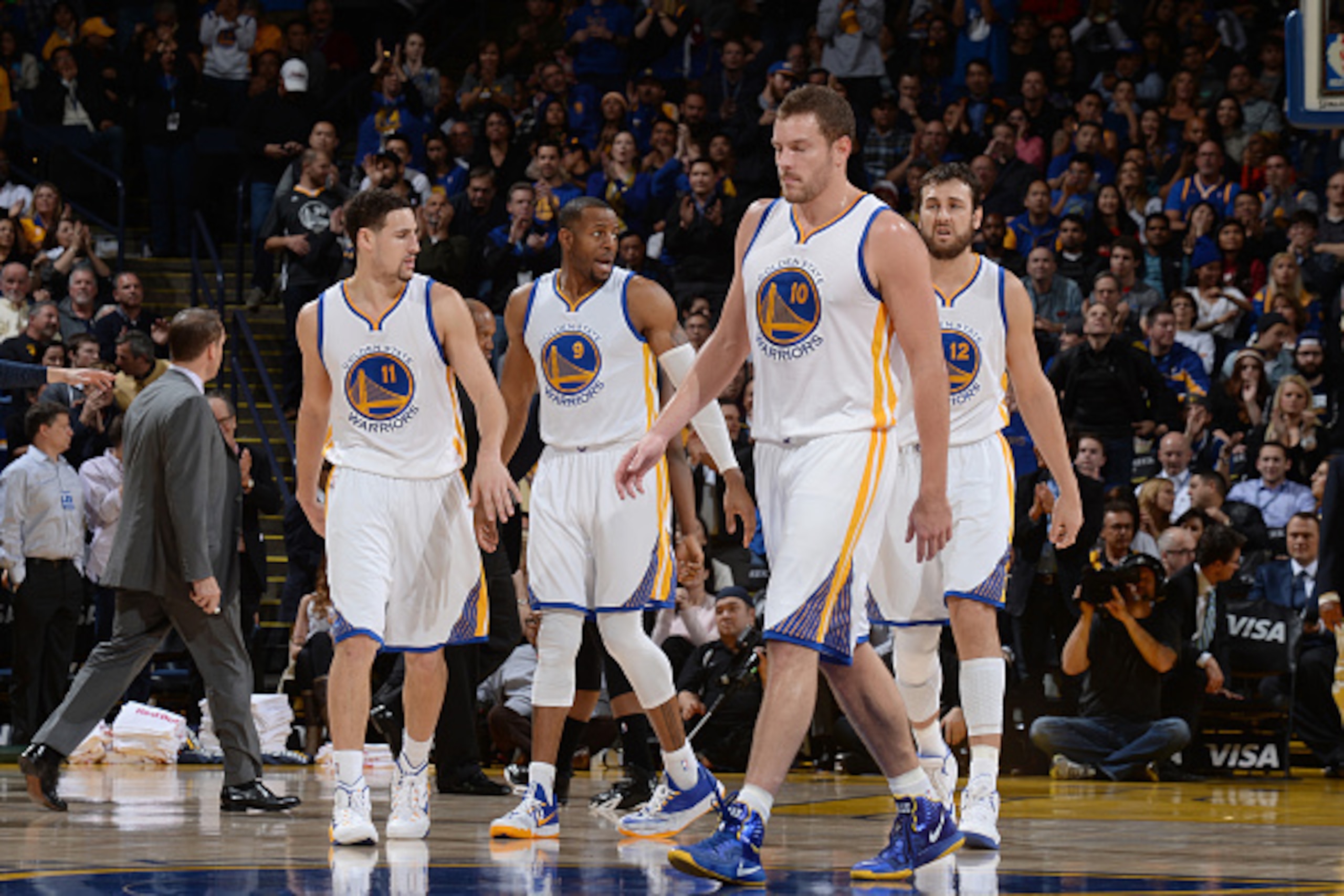 OAKLAND, CA - JANUARY 7: Klay Thompson #11, Andre Iguodala #9, David Lee #10 and Andrew Bogut #12 of the Golden State Warriors during against the Indiana Pacers the game on January 7, 2015 at ORACLE Arena in Oakland, California. NOTE TO USER: User express