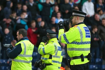 BLACKBURN, ENGLAND - FEBRUARY 14:  Police video football fans during the FA Cup fifth round match between Blackburn Rovers and Stoke City at Ewood park on February 14, 2015 in Blackburn, England.  (Photo by Getty Images)