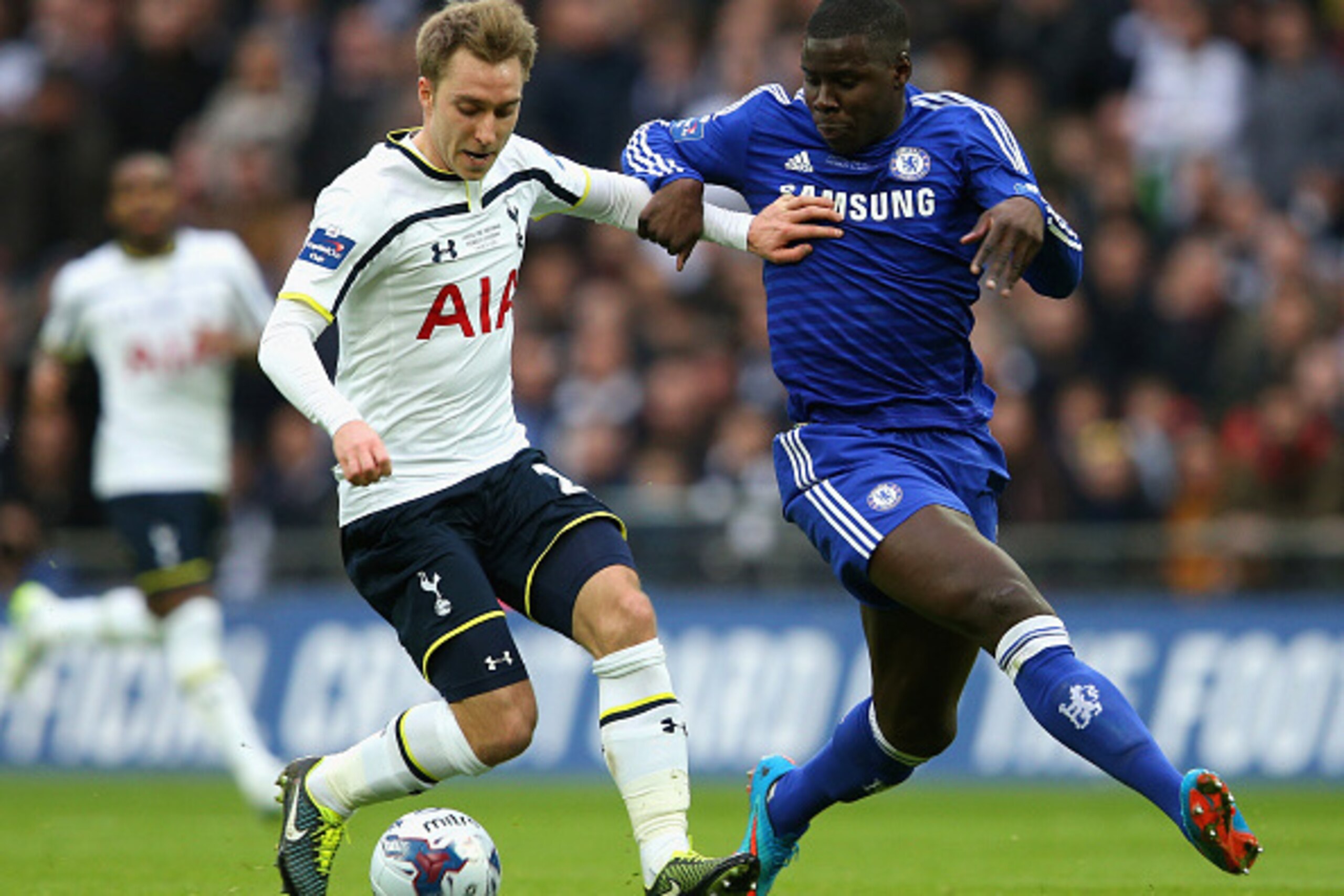 LONDON, ENGLAND - MARCH 01:  Christian Eriksen of Spurs and Kurt Zouma of Chelsea battle for the ball during the Capital One Cup Final match between Chelsea and Tottenham Hotspur at Wembley Stadium on March 1, 2015 in London, England.  (Photo by Clive Mas