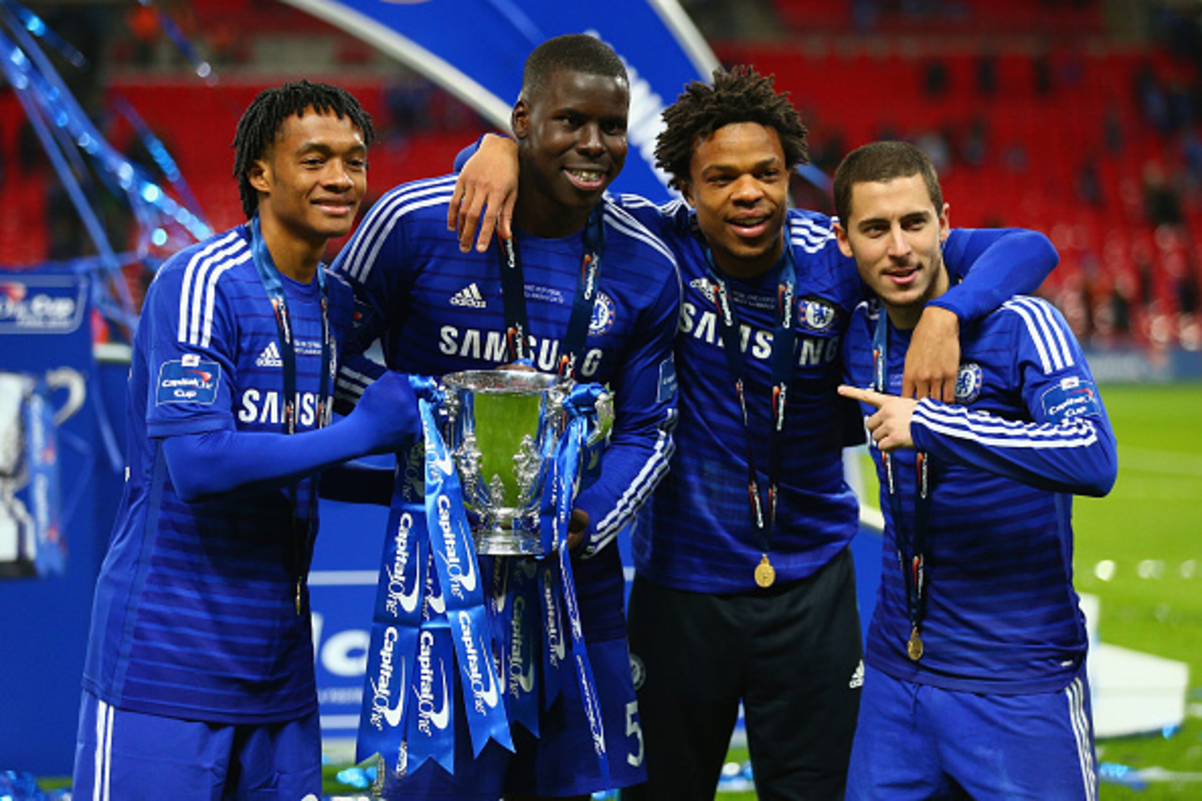 LONDON, ENGLAND - MARCH 01:  Juan Cuadrado, Kurt Zouma, Loic Remy and Eden Hazard of Chelsea pose with the trophy during the Capital One Cup Final match between Chelsea and Tottenham Hotspur at Wembley Stadium on March 1, 2015 in London, England.  (Photo 
