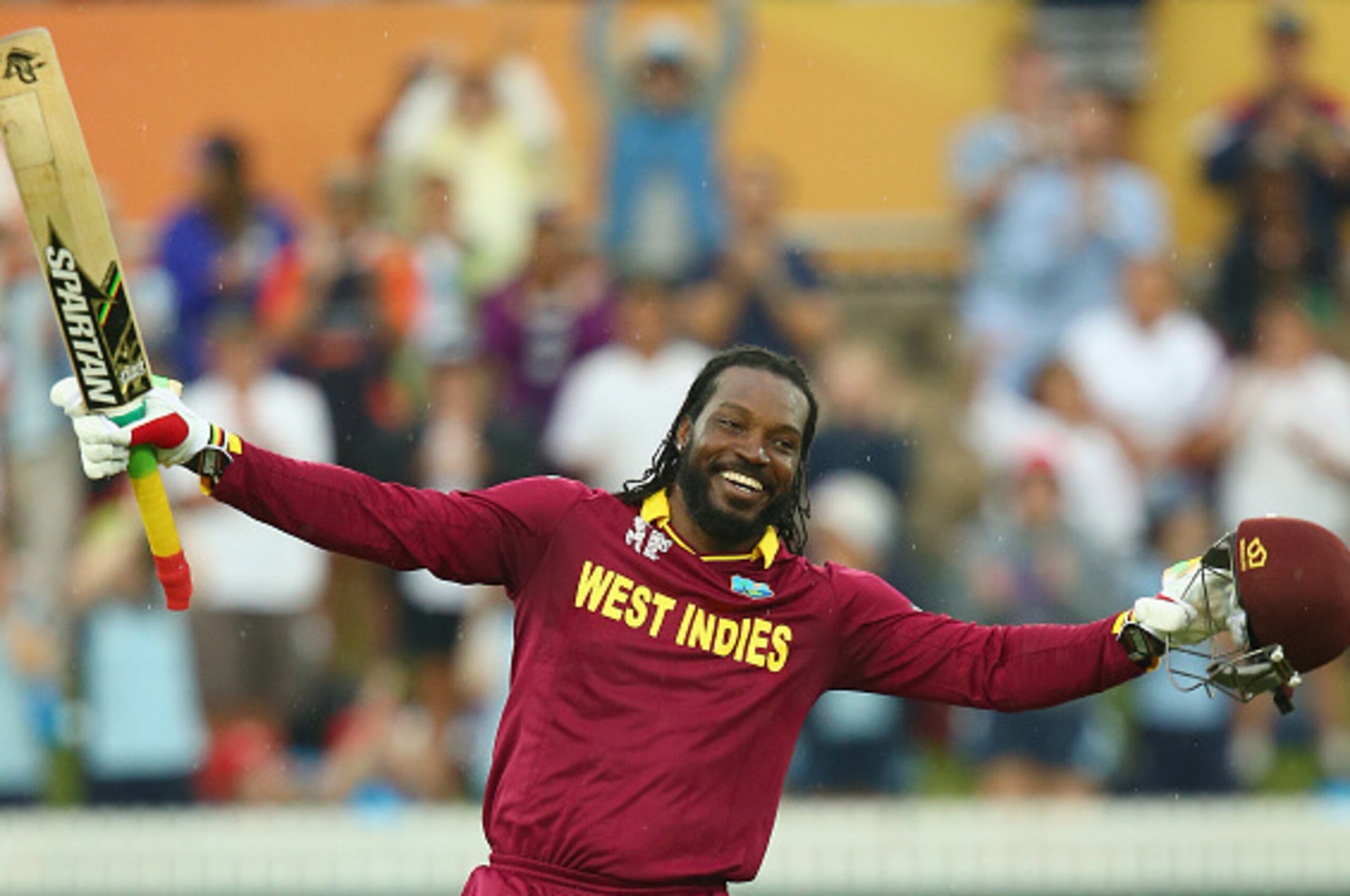 CANBERRA, AUSTRALIA - FEBRUARY 24:  Chris Gayle of West Indies celebrates his double century during the 2015 ICC Cricket World Cup match between the West Indies and Zimbabwe at Manuka Oval on February 24, 2015 in Canberra, Australia.  (Photo by Mark Kolbe