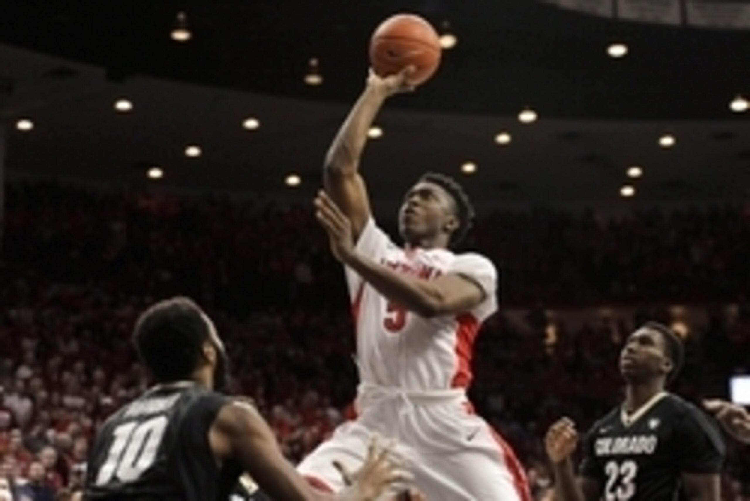 Jan 15, 2015; Tucson, AZ, USA; Arizona Wildcats forward Stanley Johnson (5) shoots the ball over Colorado Buffaloes guard/forward Tre'Shaun Fletcher (10) during the second half at McKale Center. The Wildcats won 68-54. Mandatory Credit: Casey Sapio-USA TO