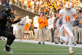 NASHVILLE, TN - NOVEMBER 29:  Head coach Butch Jones of the Tennessee Volunteers watches his quarterback Joshua Dobbs #11 rush during the first half of a game against the Vanderbilt Commodores at Vanderbilt Stadium on November 29, 2014 in Nashville, Tenne