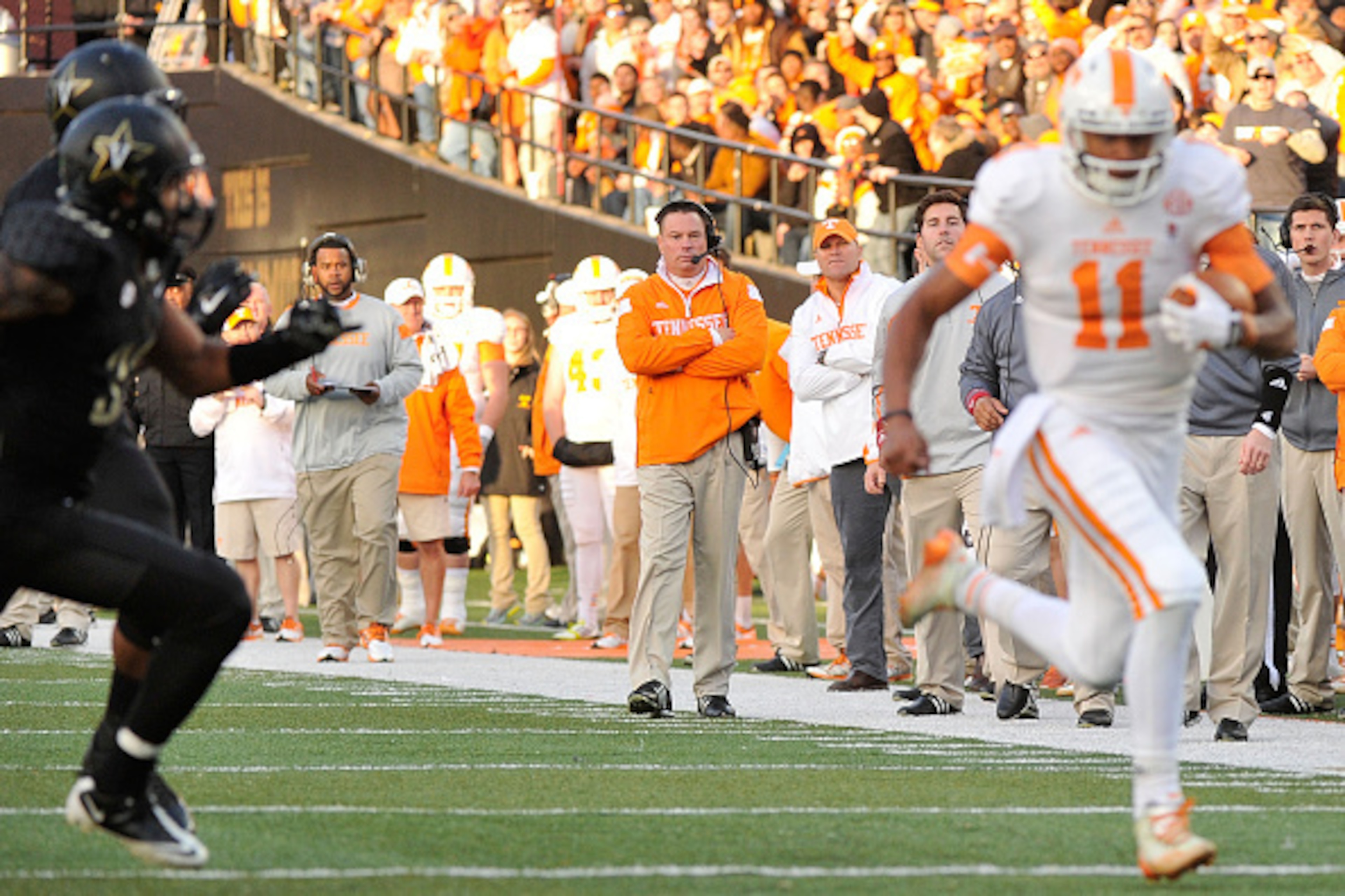NASHVILLE, TN - NOVEMBER 29:  Head coach Butch Jones of the Tennessee Volunteers watches his quarterback Joshua Dobbs #11 rush during the first half of a game against the Vanderbilt Commodores at Vanderbilt Stadium on November 29, 2014 in Nashville, Tenne
