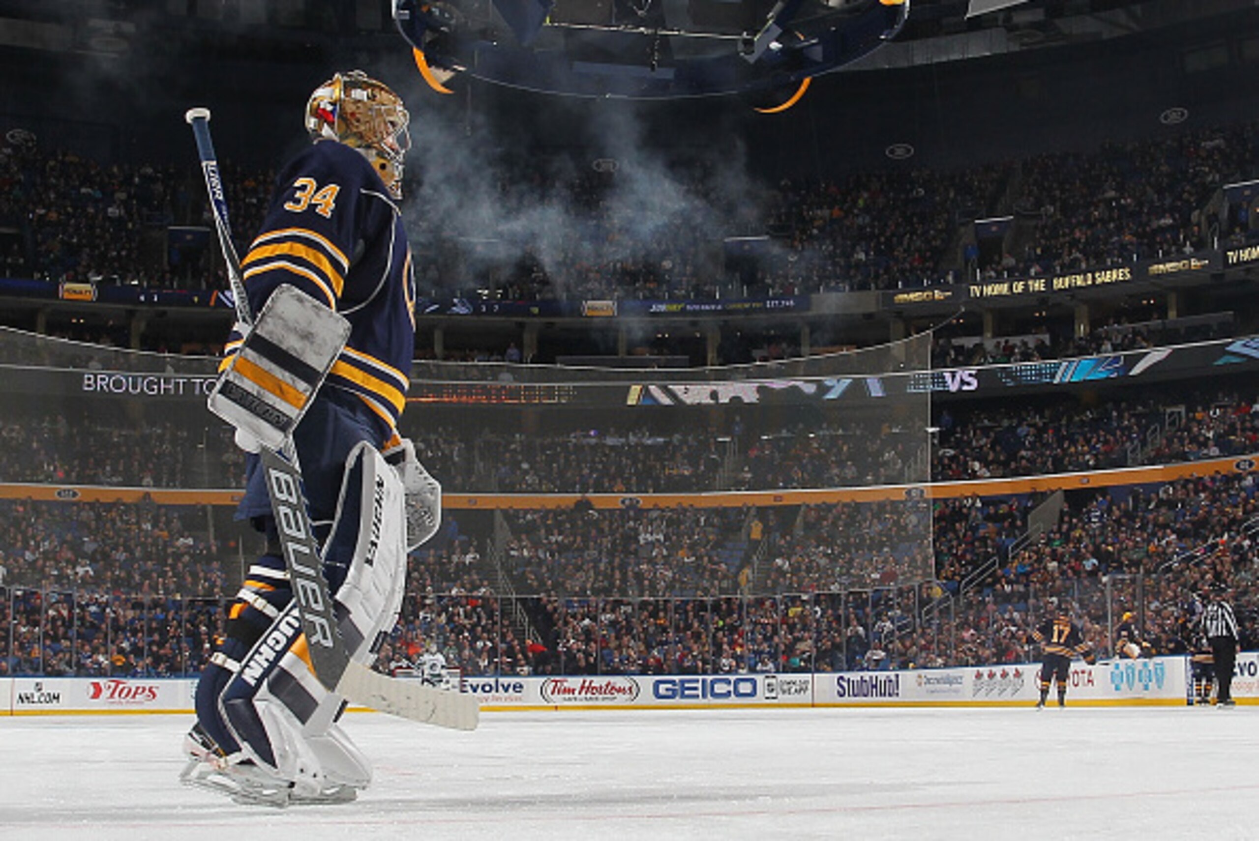 BUFFALO, NY - FEBRUARY 26: Michal Neuvirth #34 of the Buffalo Sabres skates from the net after a Buffalo goal against the Vancouver Canucks on February 26, 2015 at the First Niagara Center in Buffalo, New York.  (Photo by Bill Wippert/NHLI via Getty Image