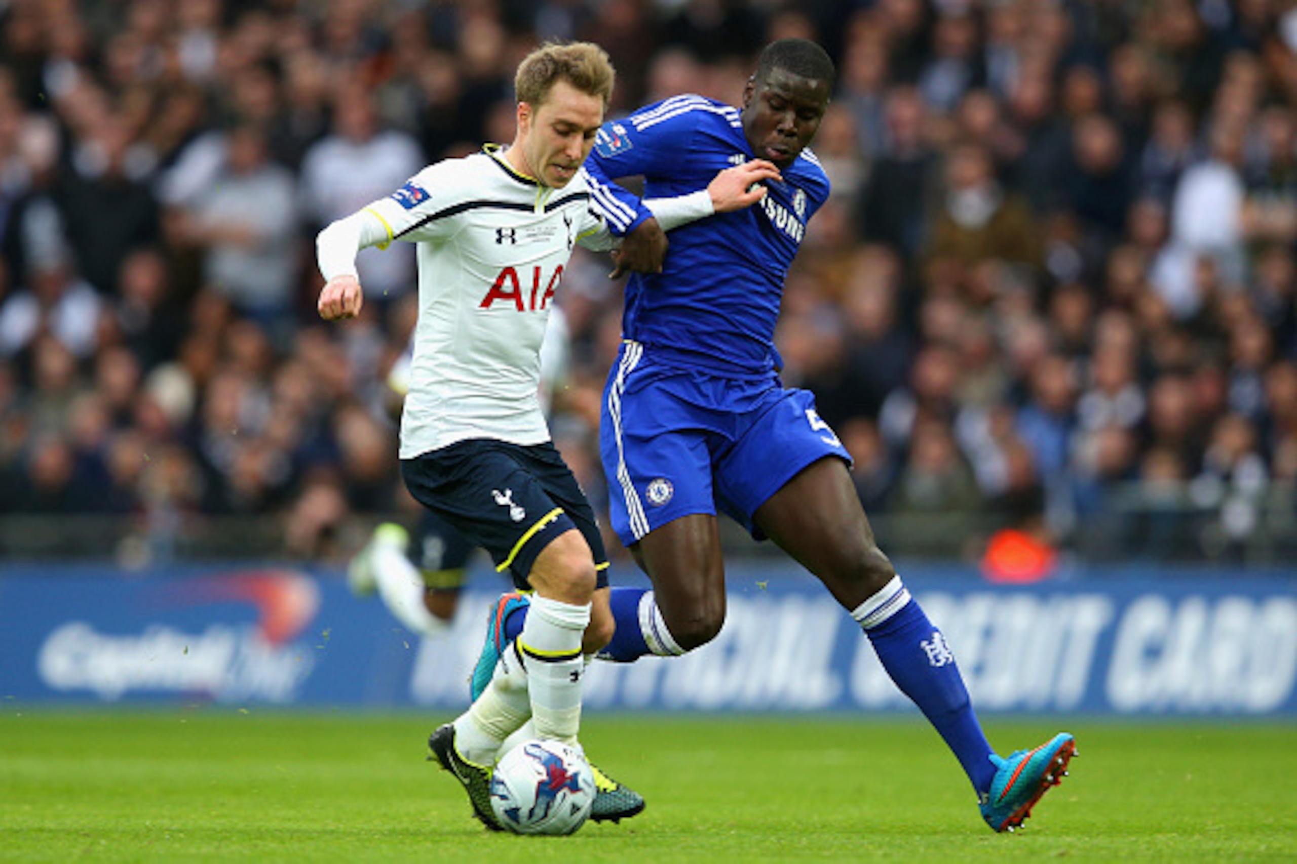 LONDON, ENGLAND - MARCH 01:  Christian Eriksen of Spurs and Kurt Zouma of Chelsea battle for the ball during the Capital One Cup Final match between Chelsea and Tottenham Hotspur at Wembley Stadium on March 1, 2015 in London, England.  (Photo by Clive Mas