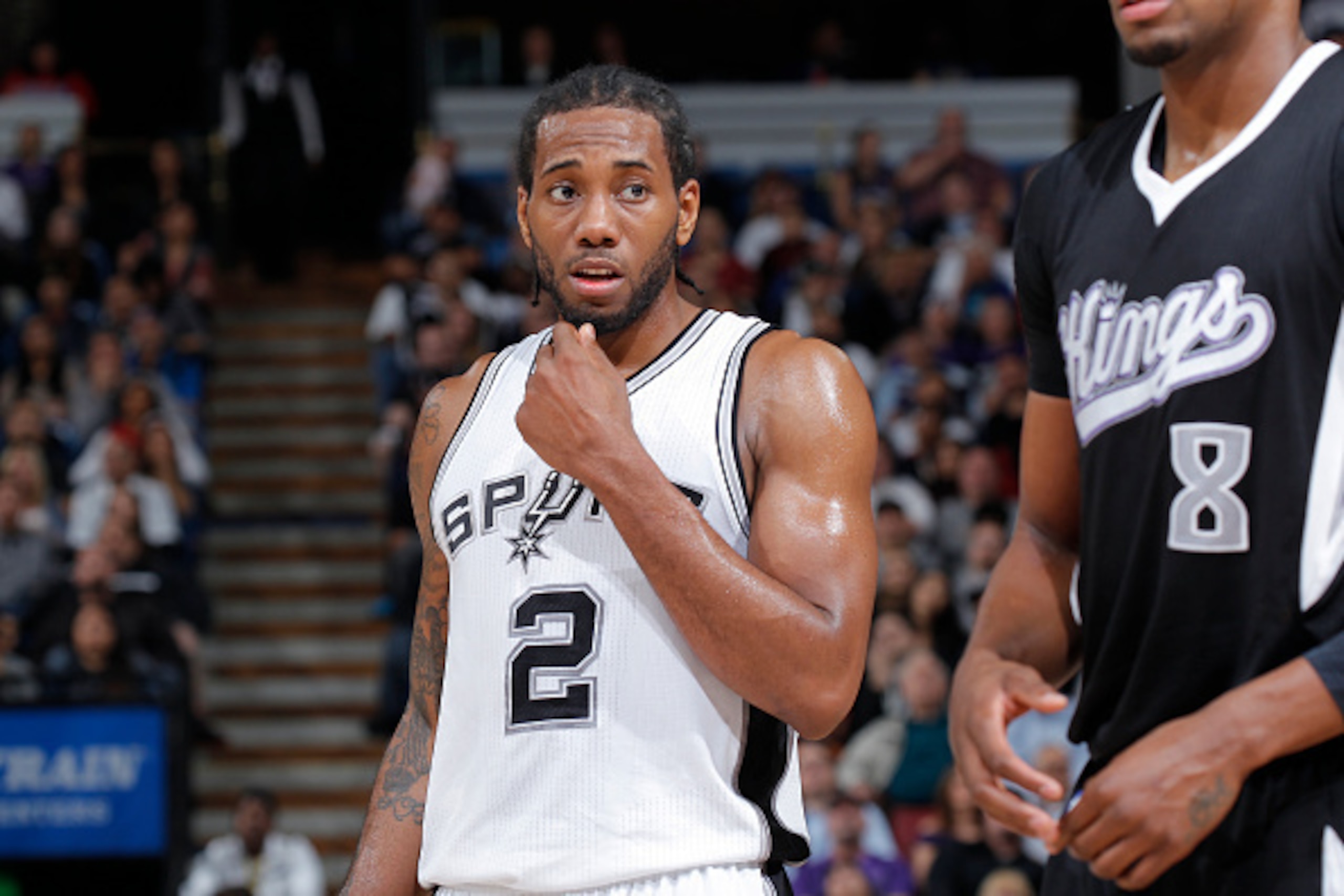 SACRAMENTO, CA - FEBRUARY 27: Kawhi Leonard #2 of the San Antonio Spurs looks on during the game against the Sacramento Kings on February 27, 2015 at Sleep Train Arena in Sacramento, California. NOTE TO USER: User expressly acknowledges and agrees that, b SACRAMENTO, CA - FEBRUARY 27: Kawhi Leonard #2 of the San Antonio Spurs looks on during the game against the Sacramento Kings on February 27, 2015 at Sleep Train Arena in Sacramento, California. NOTE TO USER: User expressly acknowledges and agrees that, b