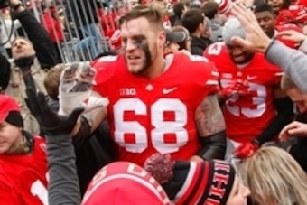 Nov 29, 2014; Columbus, OH, USA; Ohio State Buckeyes offensive lineman Taylor Decker (68) celebrates with fans following the game versus the Michigan Wolverines at Ohio Stadium. Ohio State won the game 42-28.  Mandatory Credit: Joe Maiorana-USA TODAY Spor