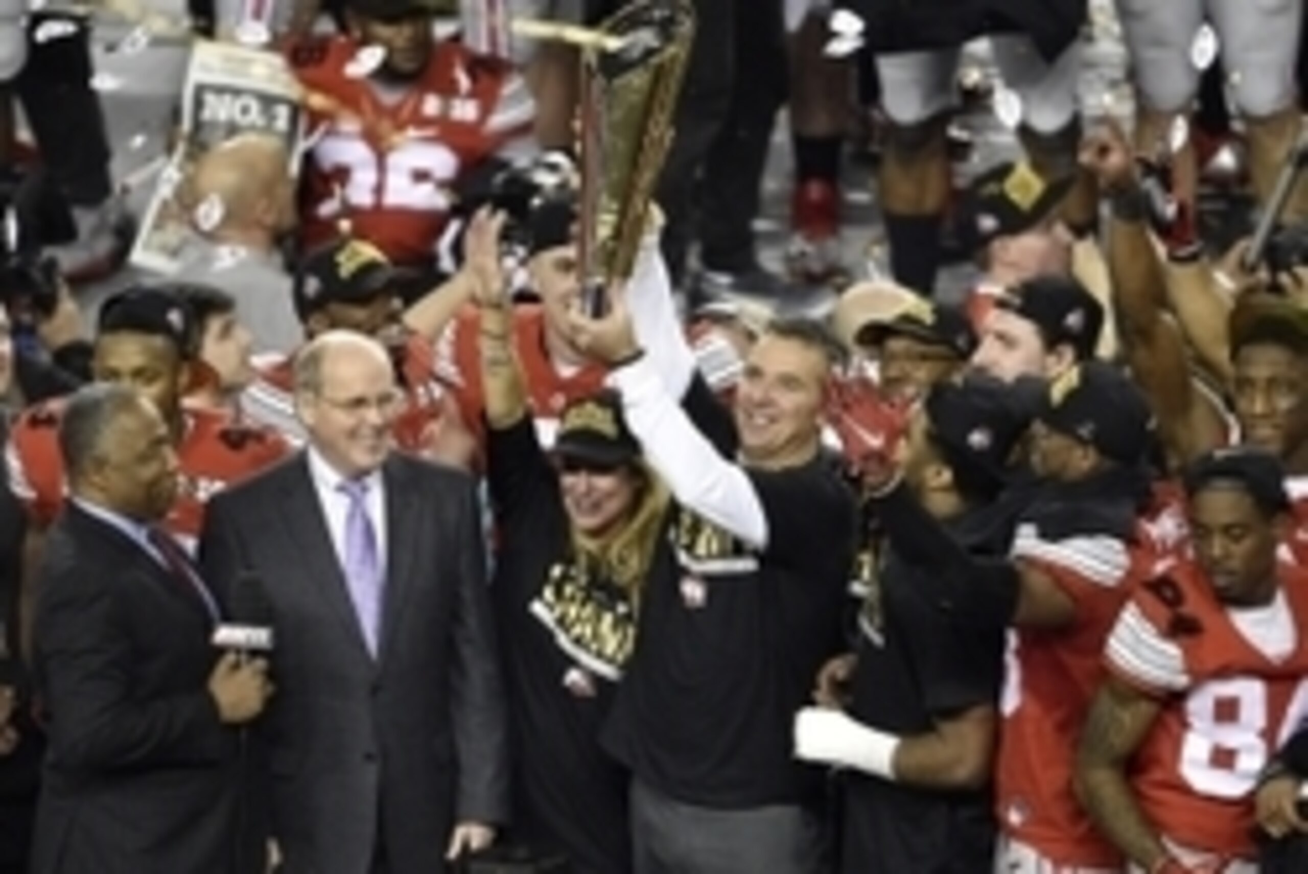 Jan 12, 2015; Arlington, TX, USA; Ohio State Buckeyes head coach Urban Meyer holds up the trophy after the win over the Oregon Ducks in the 2015 CFP National Championship Game at AT&T Stadium. Ohio State won 42-20. Mandatory Credit: Jerome Miron-USA TODAY