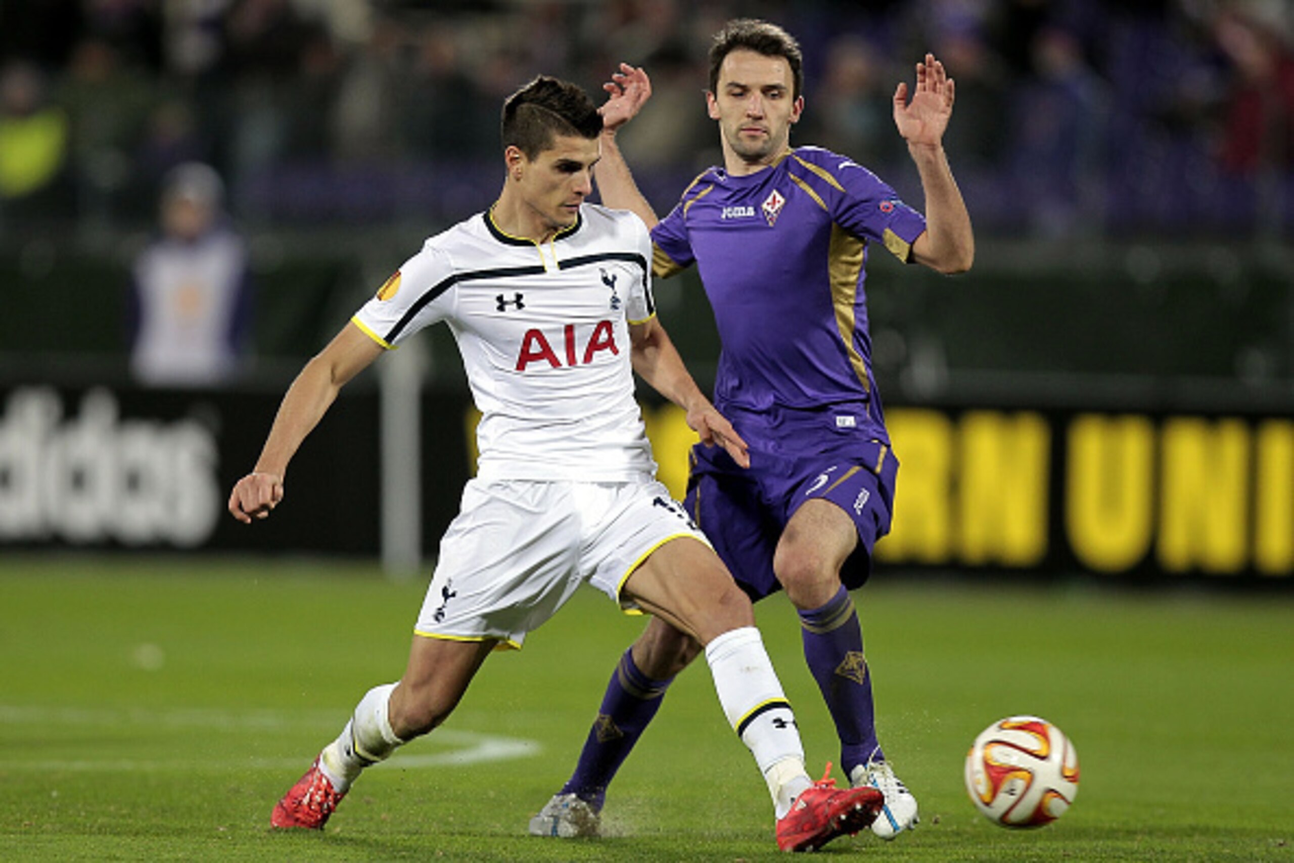 FLORENCE, ITALY - FEBRUARY 26: Milan Dabelj of ACF Fiorentina  battles for the ball with Erik Lamela of Tottenham Hotspur FC during the UEFA Europa League Round of 32 match between  ACF Fiorentina and Tottenham Hotspur FC at Artemio Franchi stadium on Feb