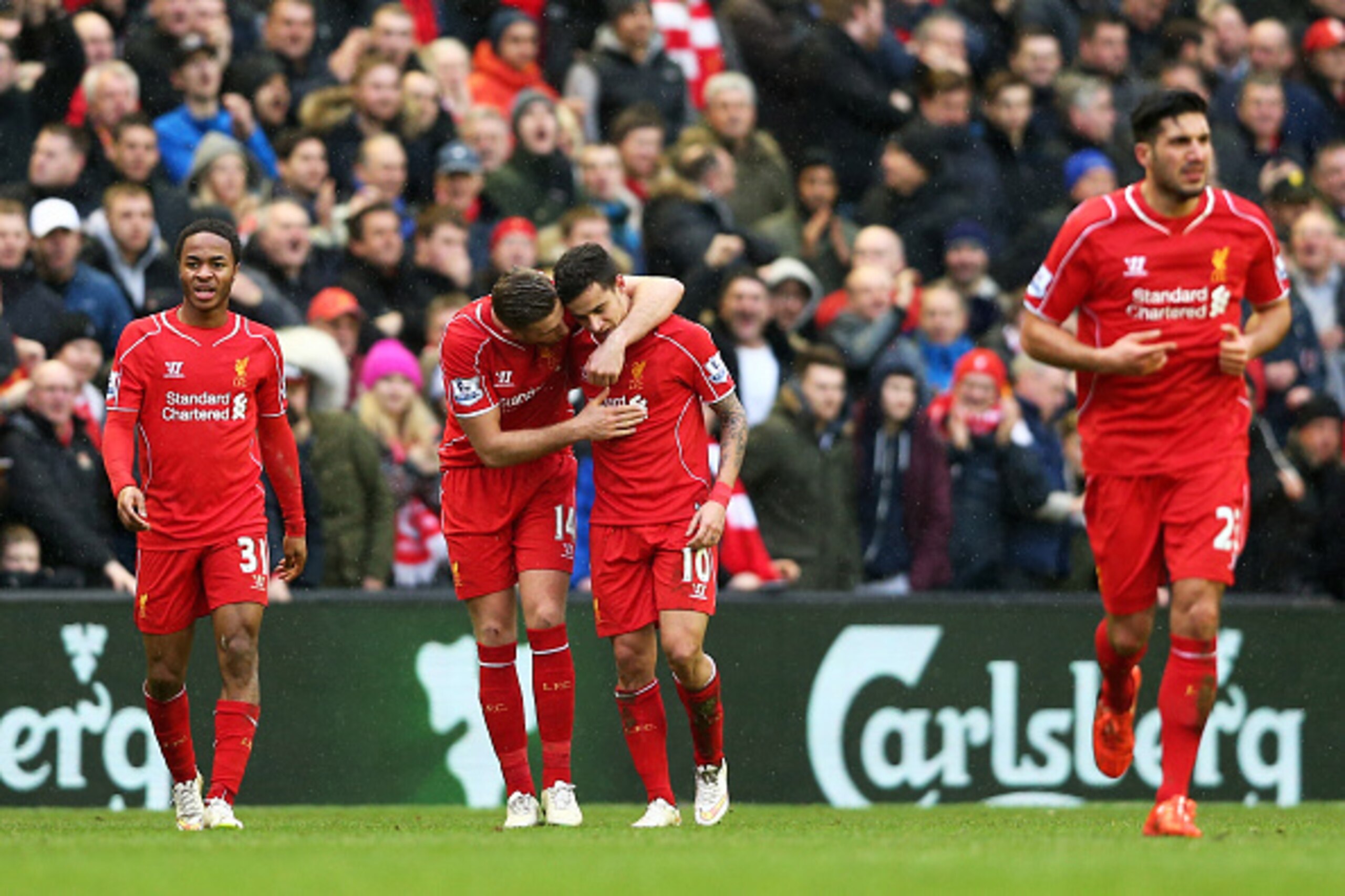 LIVERPOOL, ENGLAND - MARCH 01:  Philippe Coutinho #10 of Liverpool celebrates with teammate Jordan Henderson of Liverpool after scoring his team's second goal during the Barclays Premier League match between Liverpool and Manchester City at Anfield on Mar