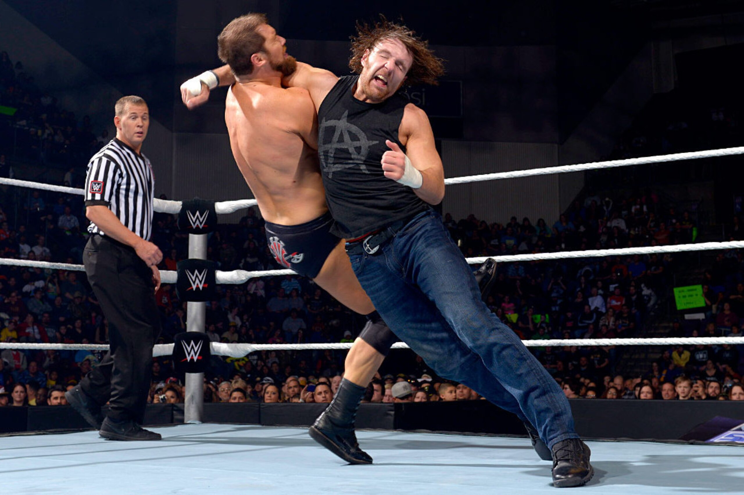 Dean Ambrose nails Curtis Axel with a clothesline.