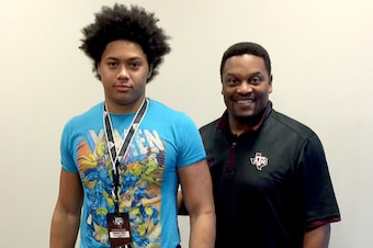 Anthony Hines III with Texas A&M head coach Kevin Sumlin