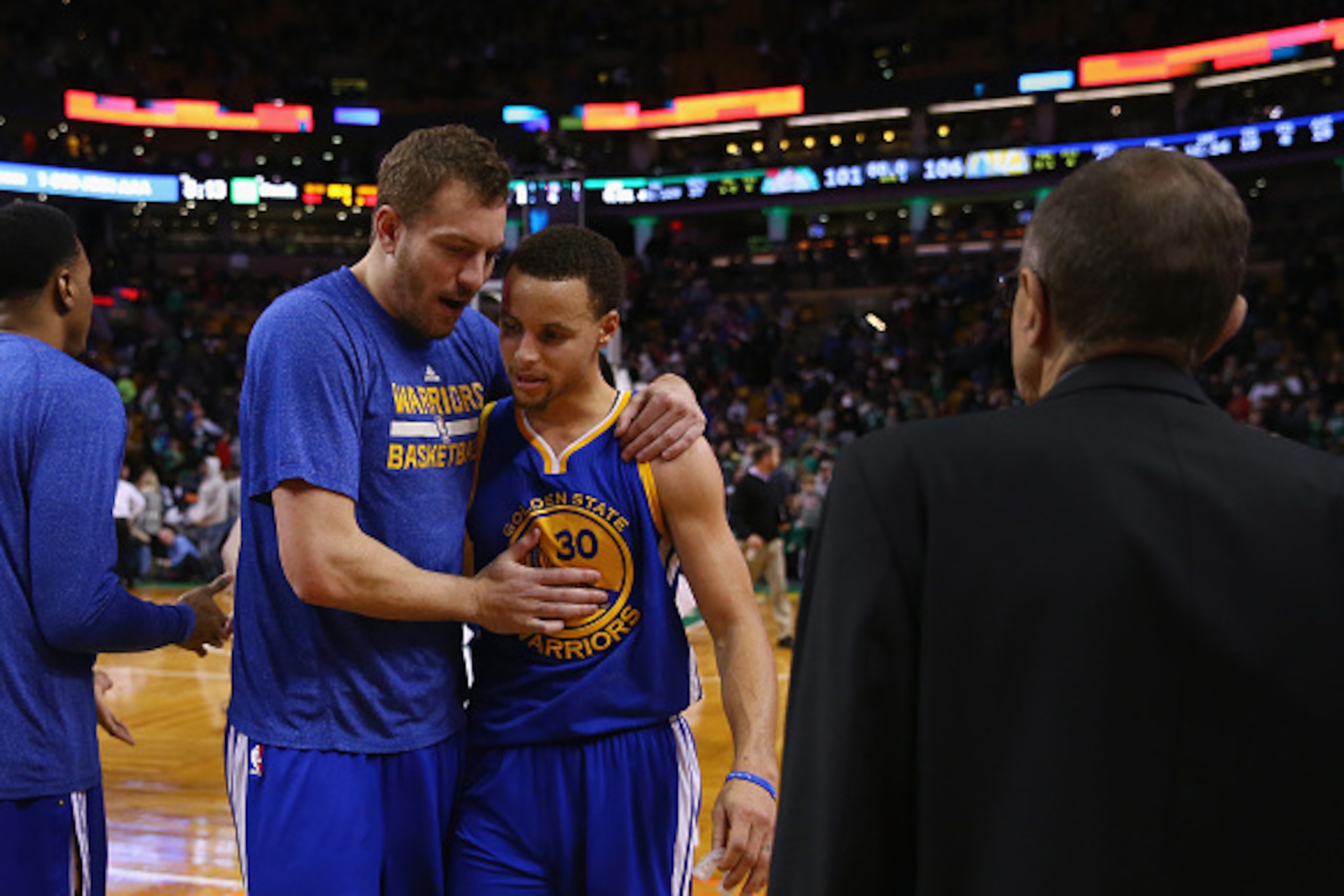 BOSTON, MA - MARCH 01:  David Lee #10 talks with Stephen Curry #30 of the Golden State Warriors after the game against the Boston Celtics at TD Garden on March 1, 2015 in Boston, Massachusetts. The Warriors defeat the Celtics 106-101. NOTE TO USER: User e