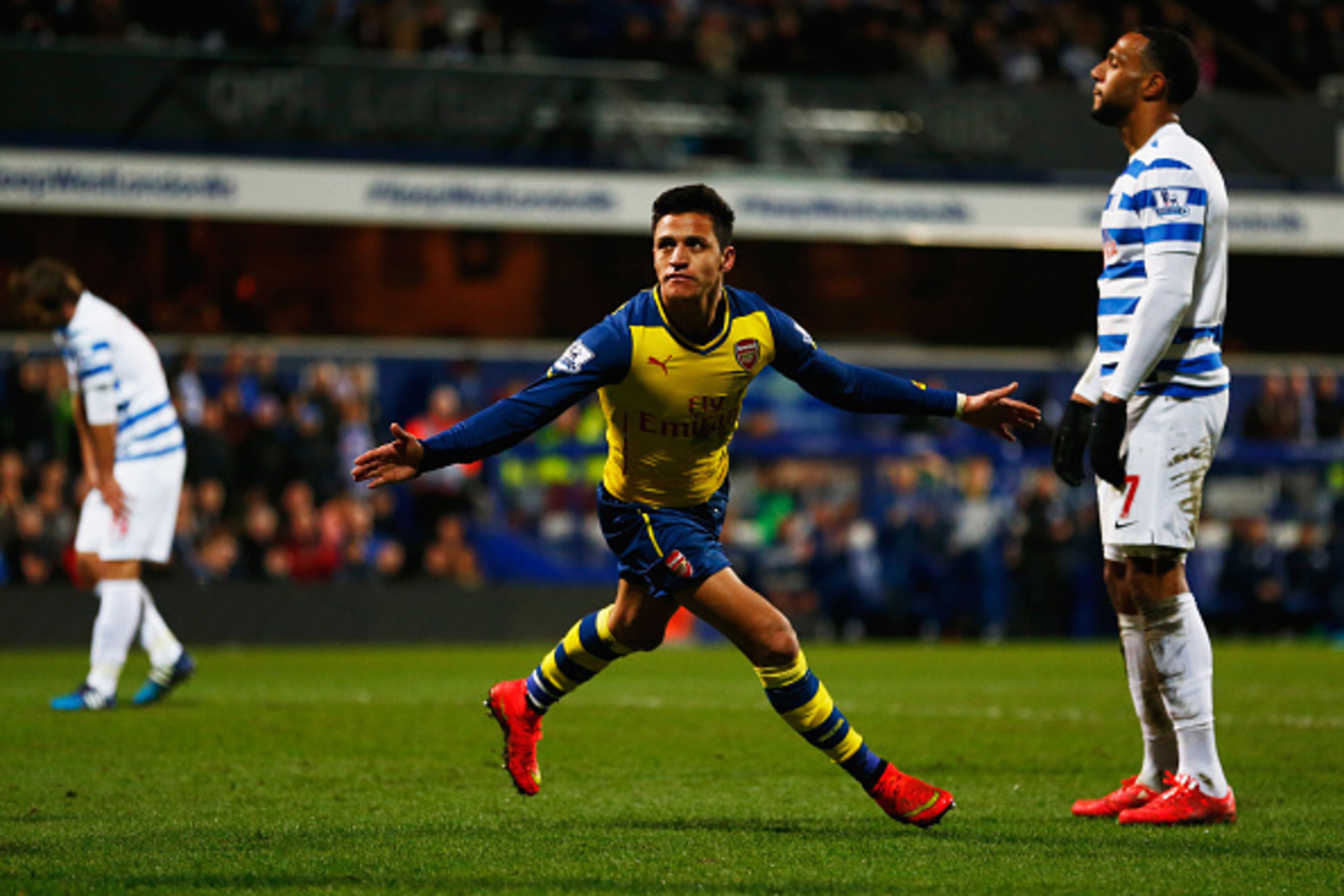 LONDON, ENGLAND - MARCH 04:  Despair for QPR players as Alexis Sanchez of Arsenal scores their second goal during the Barclays Premier League match between Queens Park Rangers and Arsenal at Loftus Road on March 4, 2015 in London, England.  (Photo by Juli