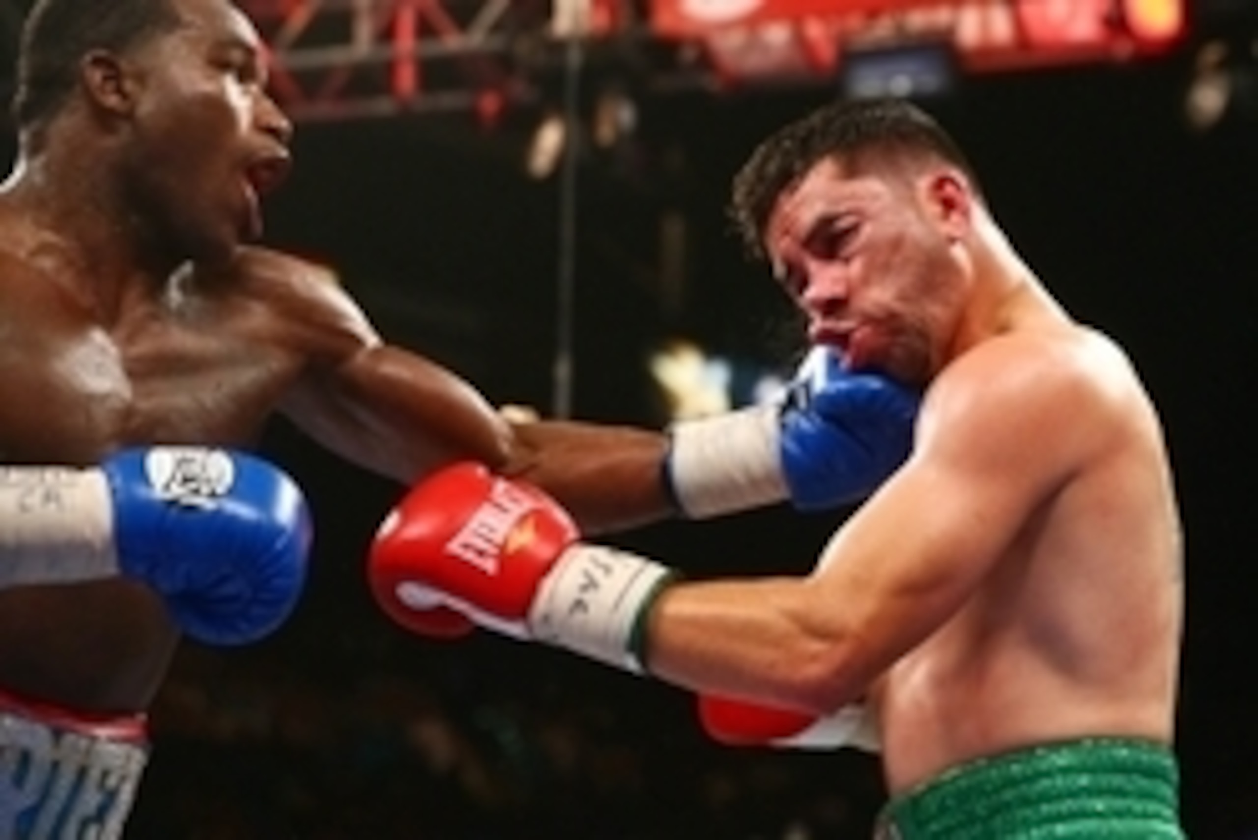 May 3, 2014; Las Vegas, NV, USA; Adrien Broner (blue gloves) lands a punch against Carlos Molina during their fight at MGM Grand. Mandatory Credit: Mark J. Rebilas-USA TODAY Sports