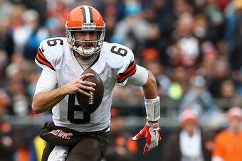 CHARLOTTE, NC - DECEMBER 21:  Brian Hoyer #6 of the Cleveland Browns scrambles for a first down against the Carolina Panthers in the 3rd quarter during their game at Bank of America Stadium on December 21, 2014 in Charlotte, North Carolina.  (Photo by Str