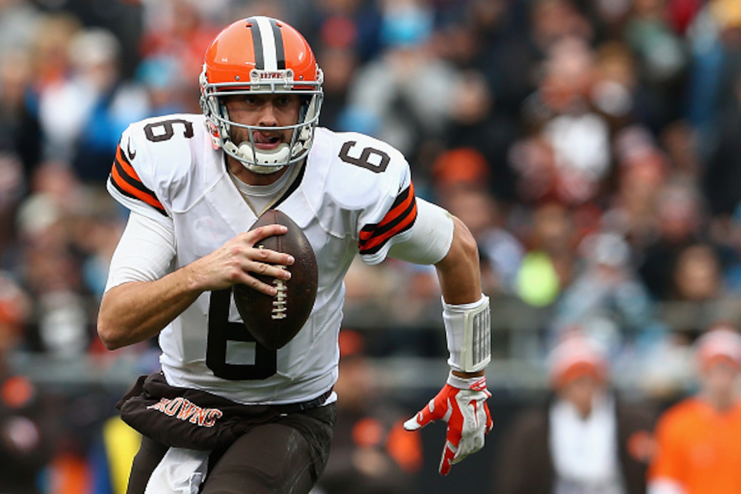 CHARLOTTE, NC - DECEMBER 21:  Brian Hoyer #6 of the Cleveland Browns scrambles for a first down against the Carolina Panthers in the 3rd quarter during their game at Bank of America Stadium on December 21, 2014 in Charlotte, North Carolina.  (Photo by Str