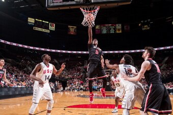 PORTLAND, OR - APRIL 12:  Emmanuel Mudiay #5 of the World Team drives to the basket during the game against Team USA on April 12, 2014 at the Moda Center Arena in Portland, Oregon. NOTE TO USER: User expressly acknowledges and agrees that, by downloading 
