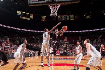 PORTLAND, OR - APRIL 12:  Emmanuel Mudiay #5 of the World Team drives to the basket during the game against Team USA on April 12, 2014 at the Moda Center Arena in Portland, Oregon. NOTE TO USER: User expressly acknowledges and agrees that, by downloading 