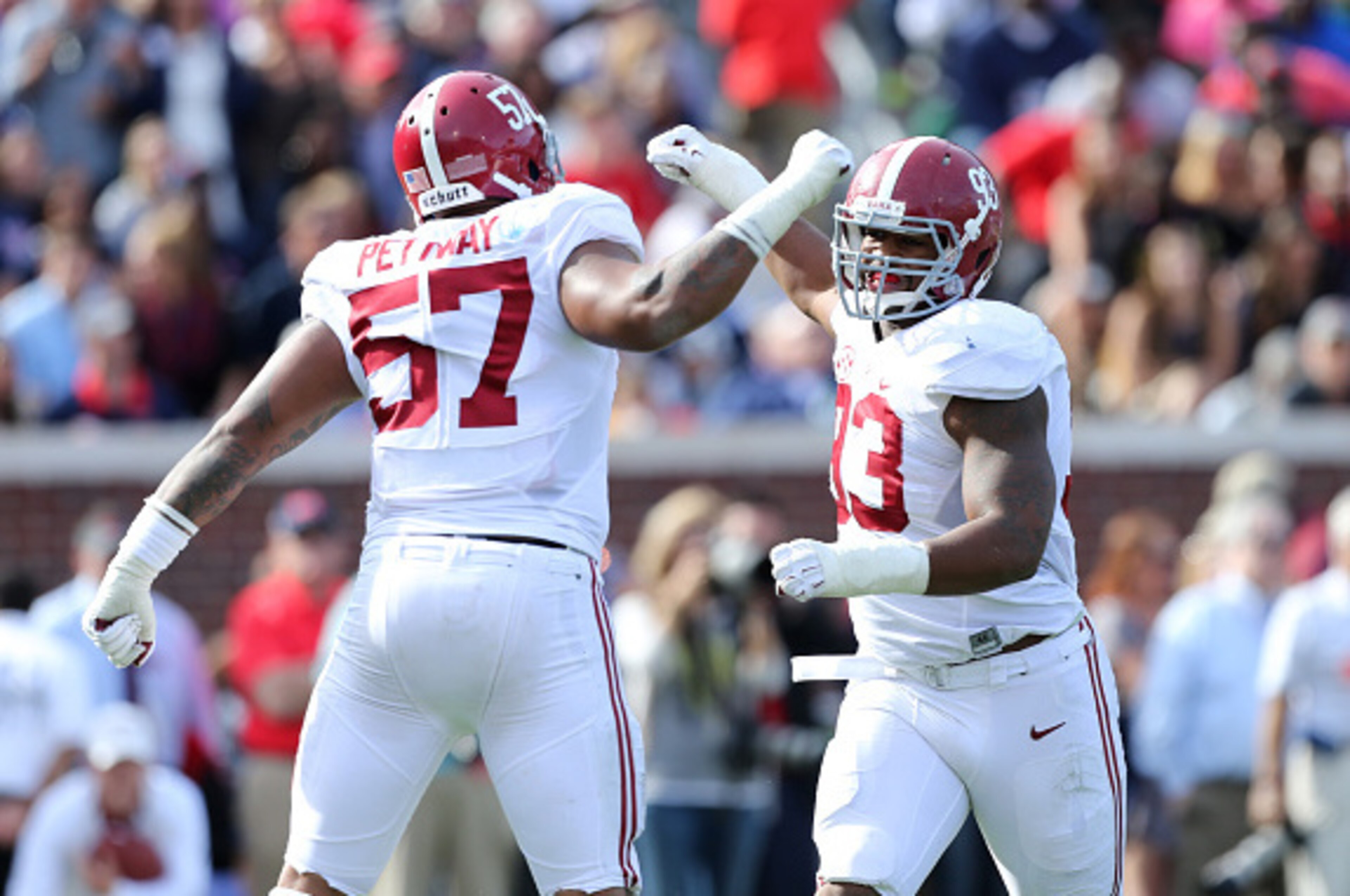 OXFORD, MS - OCTOBER 4: D.J. Petttway #57 and Jonathan Allen #93 of the Alabama Crimson Tide celebrate after a play against the Ole Miss Rebels on October 4, 2014 at Vaught-Hemingway Stadium in Oxford, Mississippi.  (Photo by Joe Murphy/Getty Images)